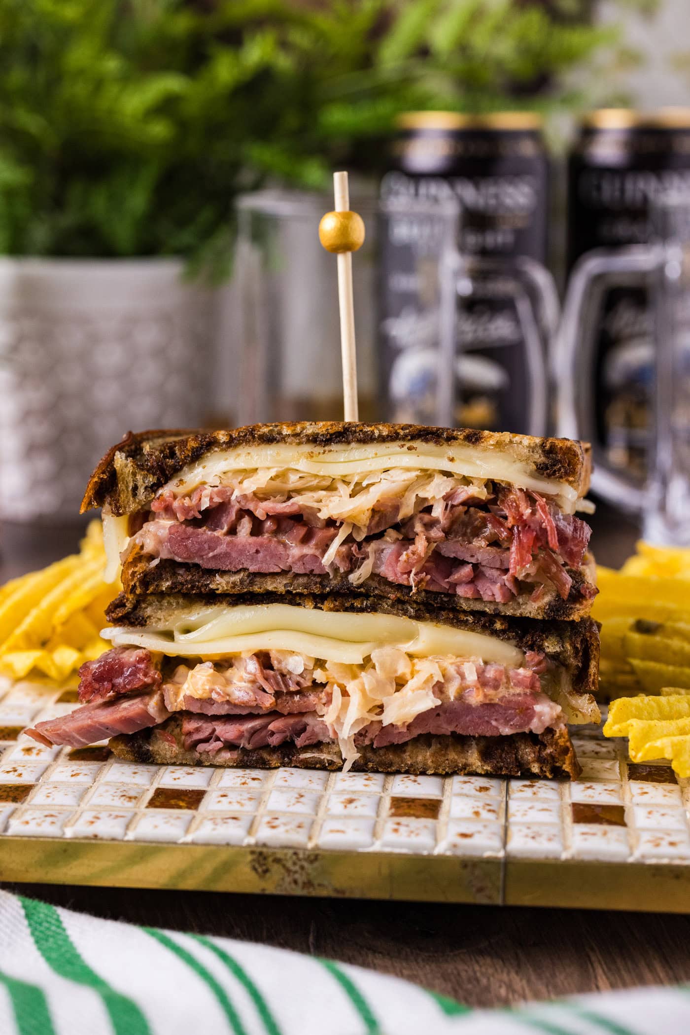 Reuben Sandwich on a plate with chips