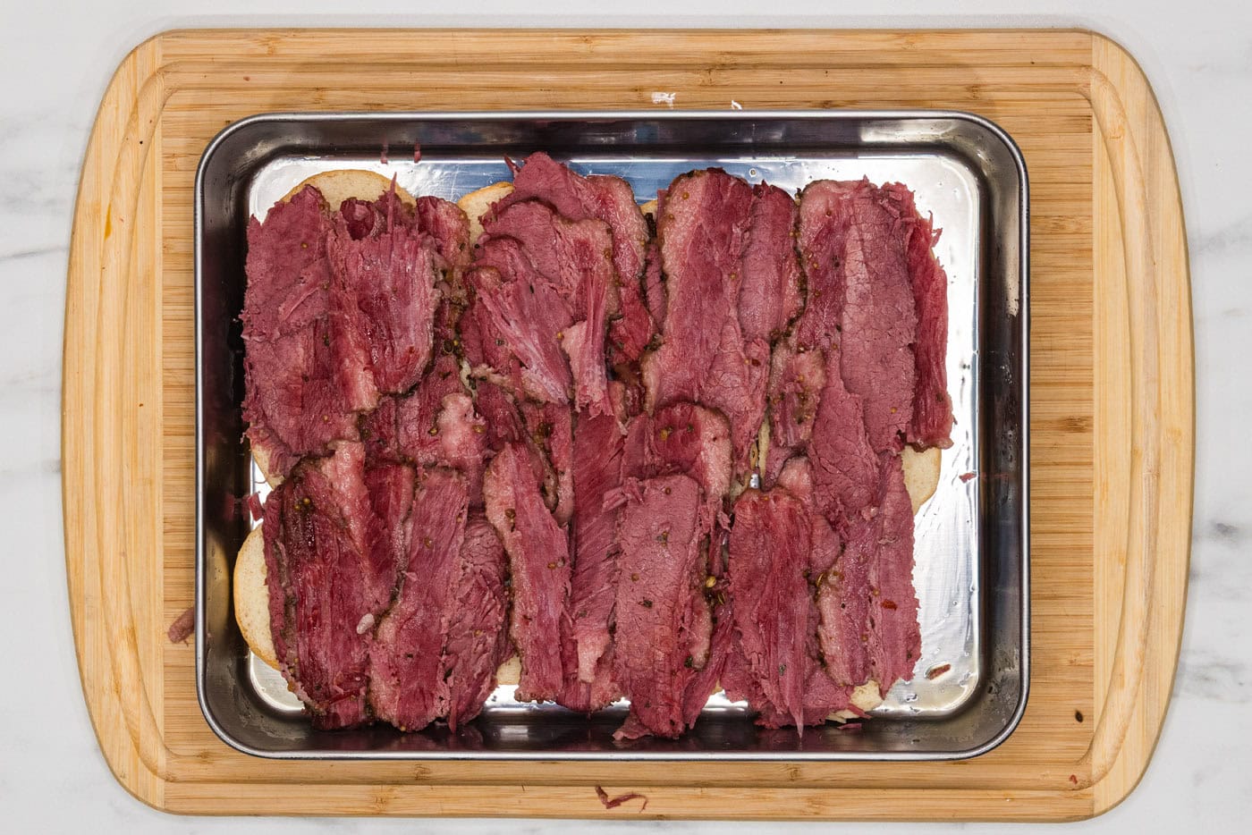 corned beef layered on top of slider buns