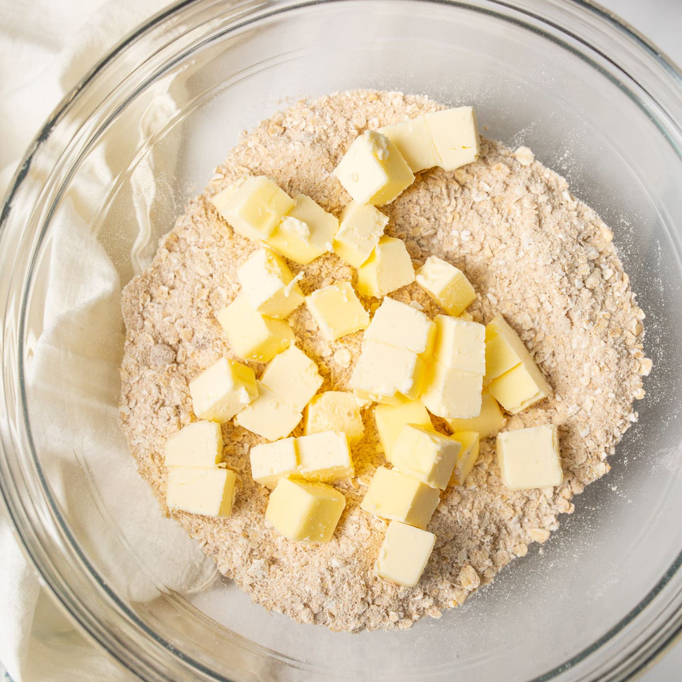 Flour mixture and butter cubes in a bowl