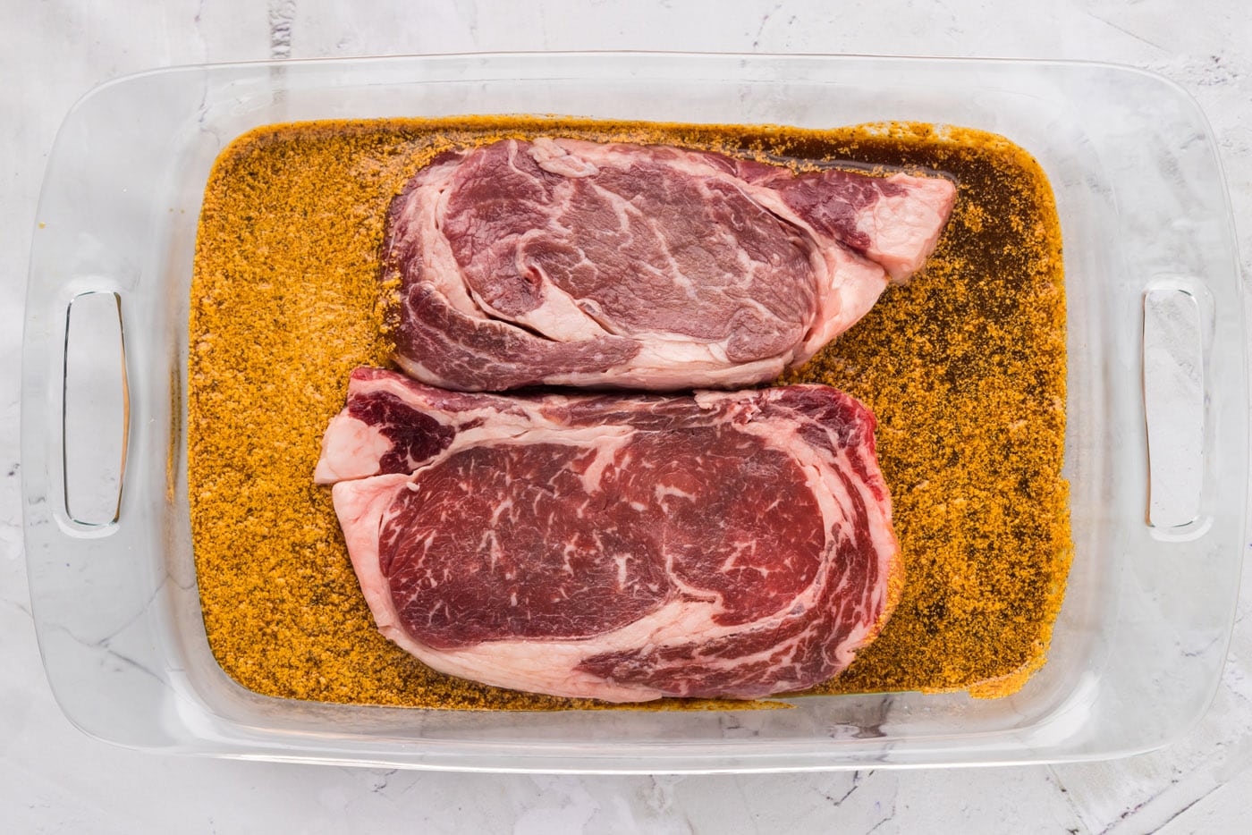 ribeye steak soaking in marinade