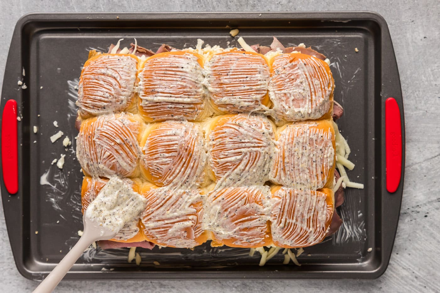basting slider buns with garlic butter