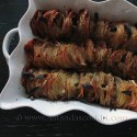 An overhead photo of crispy roast potatoes in a pan.