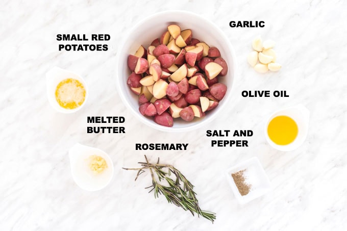 ingredients for roasted potatoes: red potatoes, garlic, butter, olive oil, rosemary, salt, and pepper