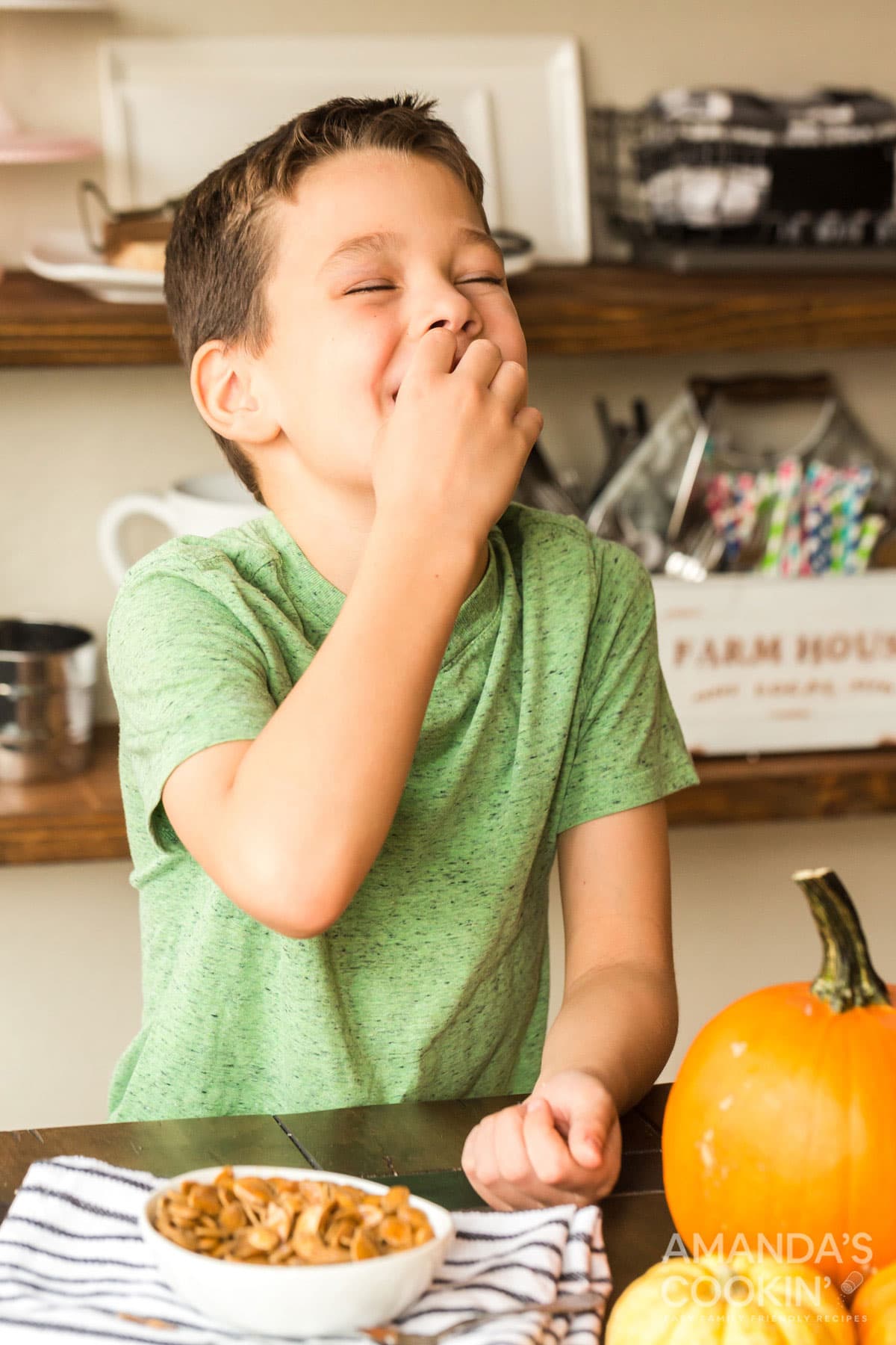 child eating roasted pumpkin seeds