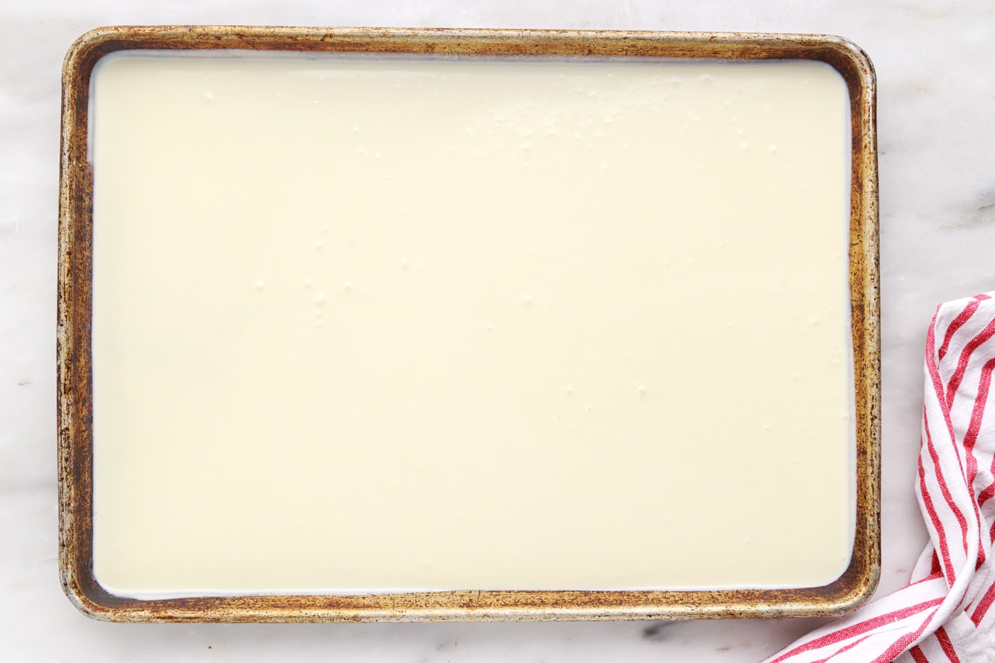 rolled ice cream on a baking sheet