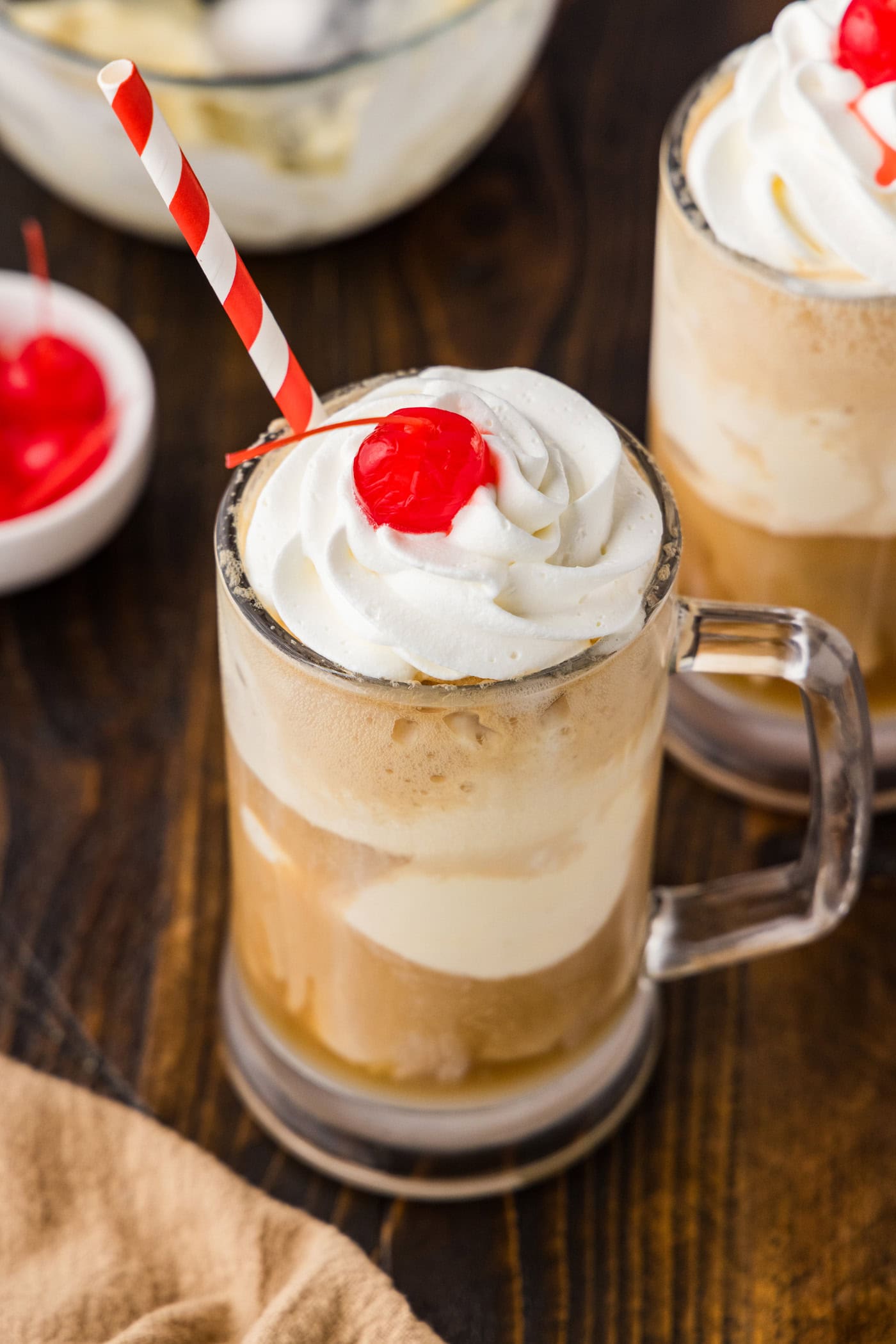 Root Beer Float Cocktail with whipped cream and cherry