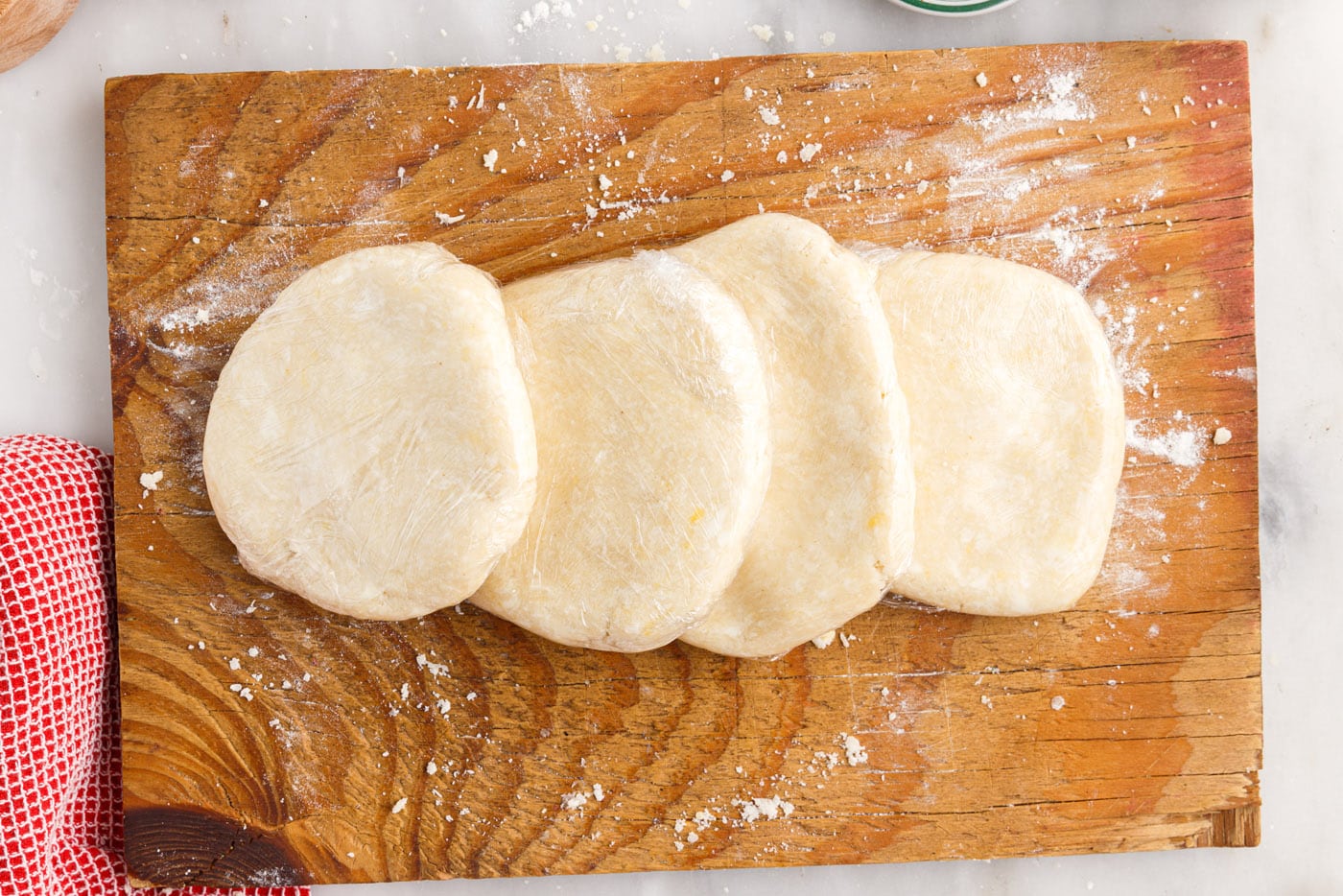 rugelach dough discs on a cutting board
