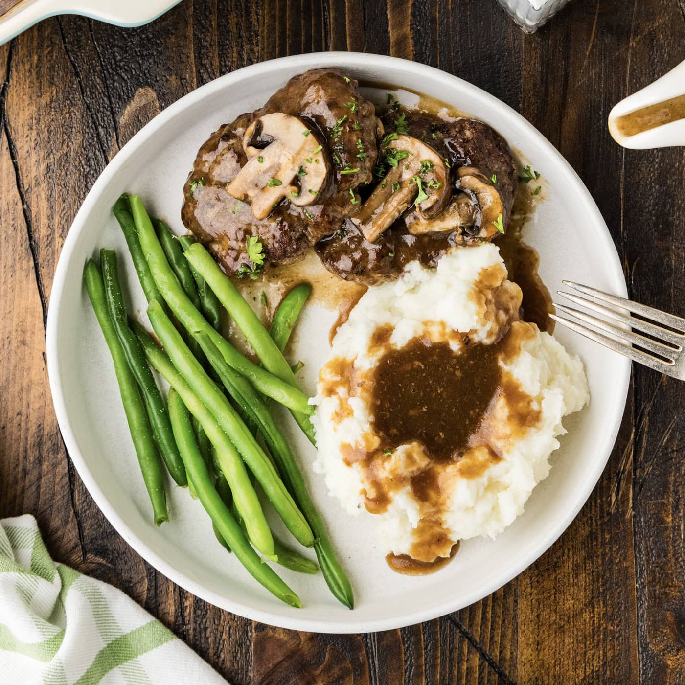 dinner plate with salisbury steaks and gravy