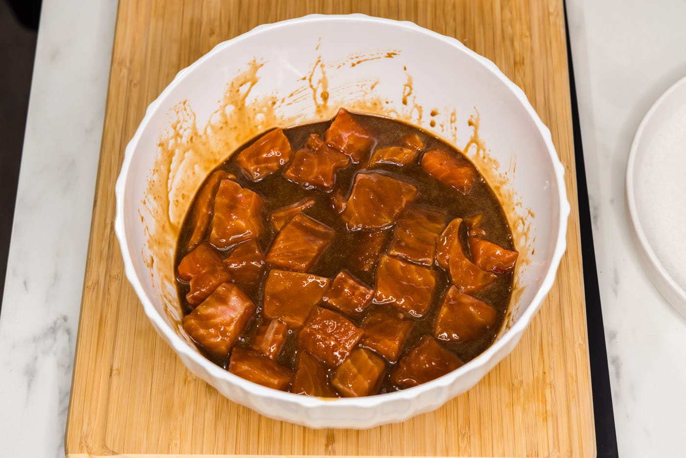 salmon bites marinating in a bowl
