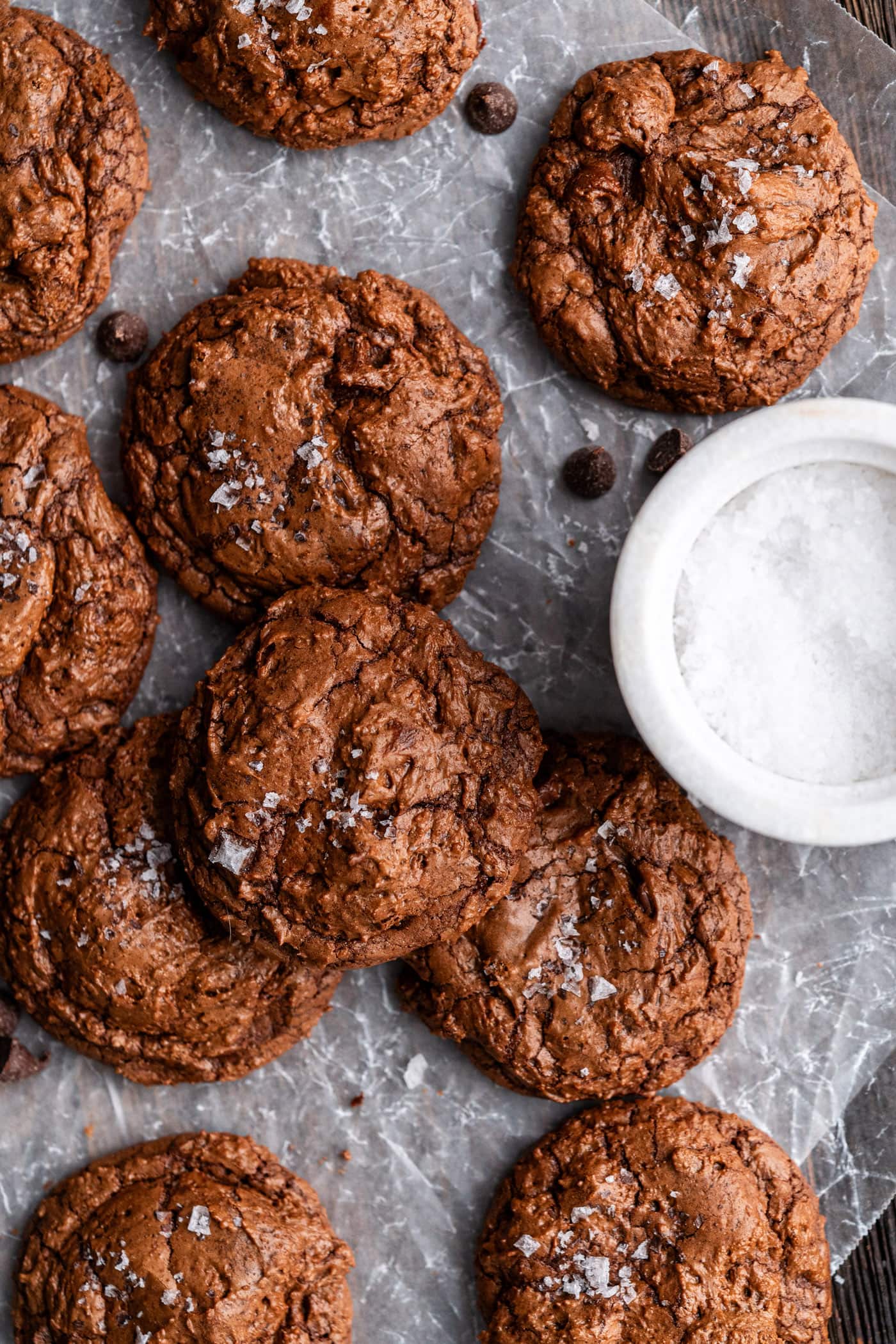 Salted Brownie Cookies resting on parchment paper