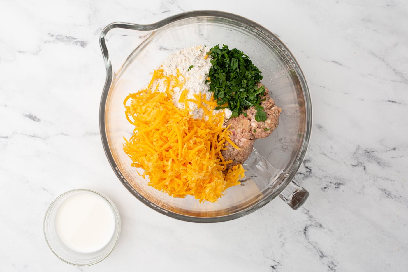 sausage ball ingredients in a mixing bowl