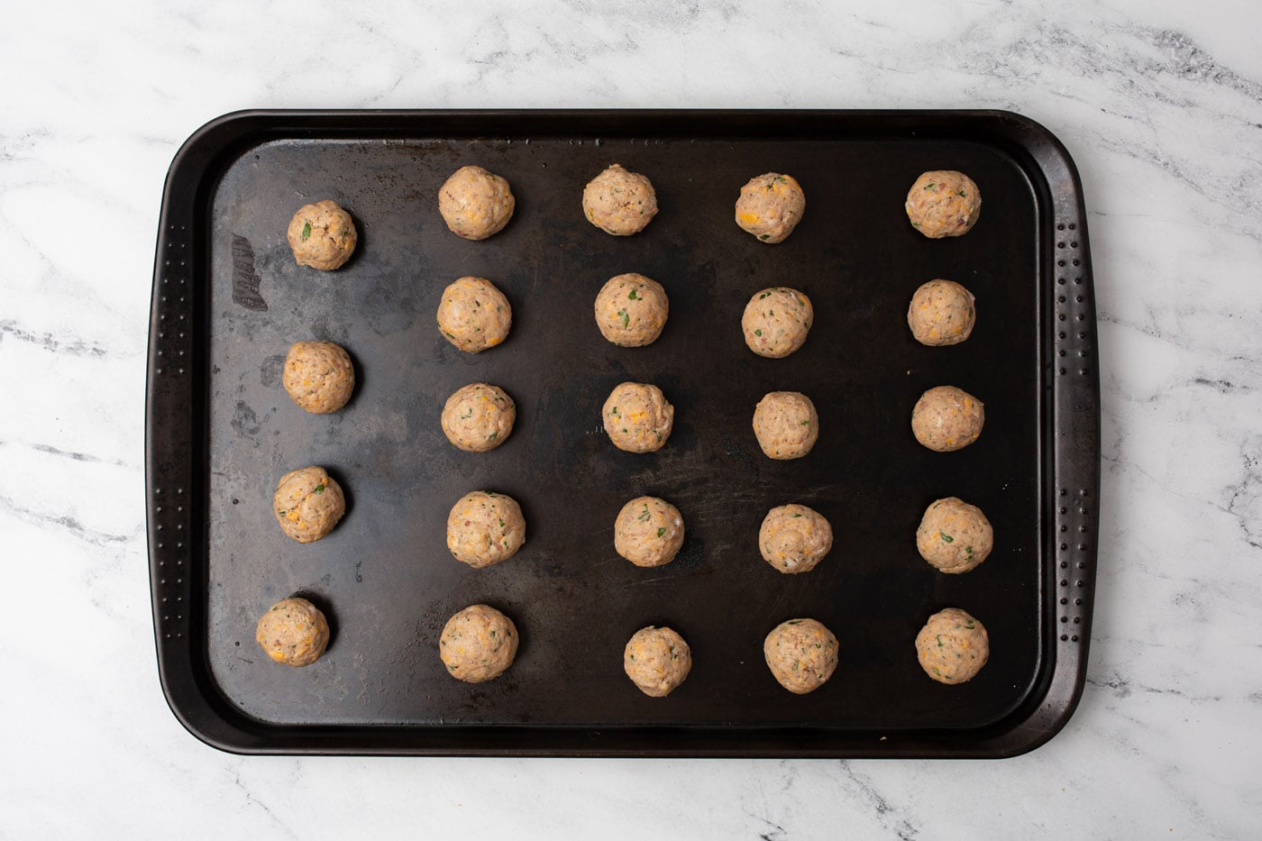 sausage balls on a baking sheet