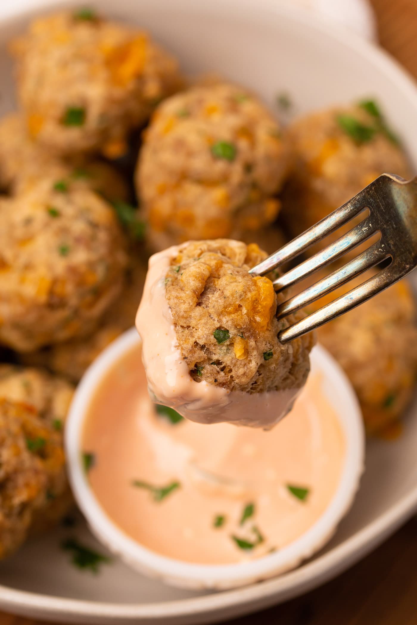 Sausage Balls dipped in sauce
