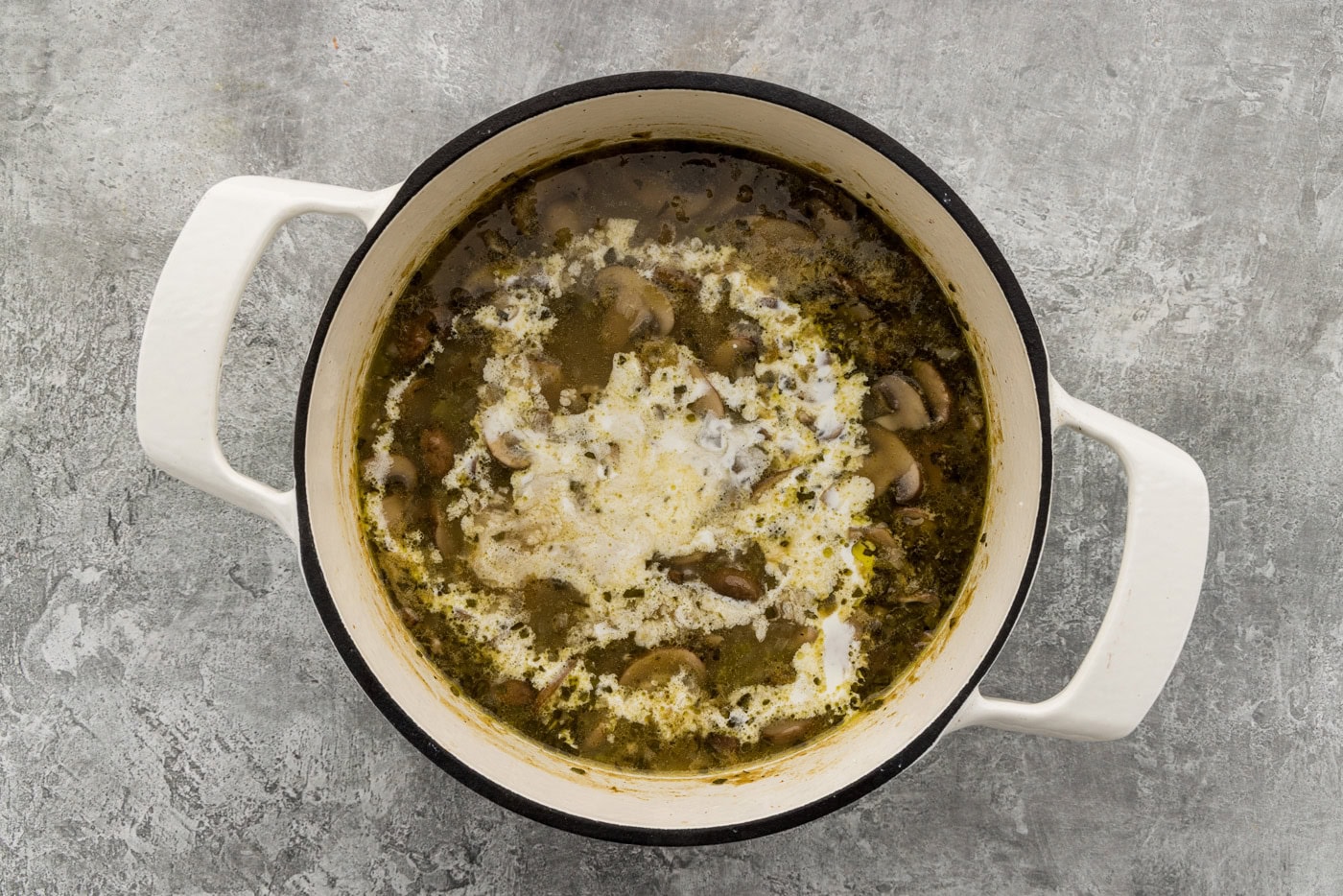Heavy cream stirred into the simmering sausage mushroom wild rice soup