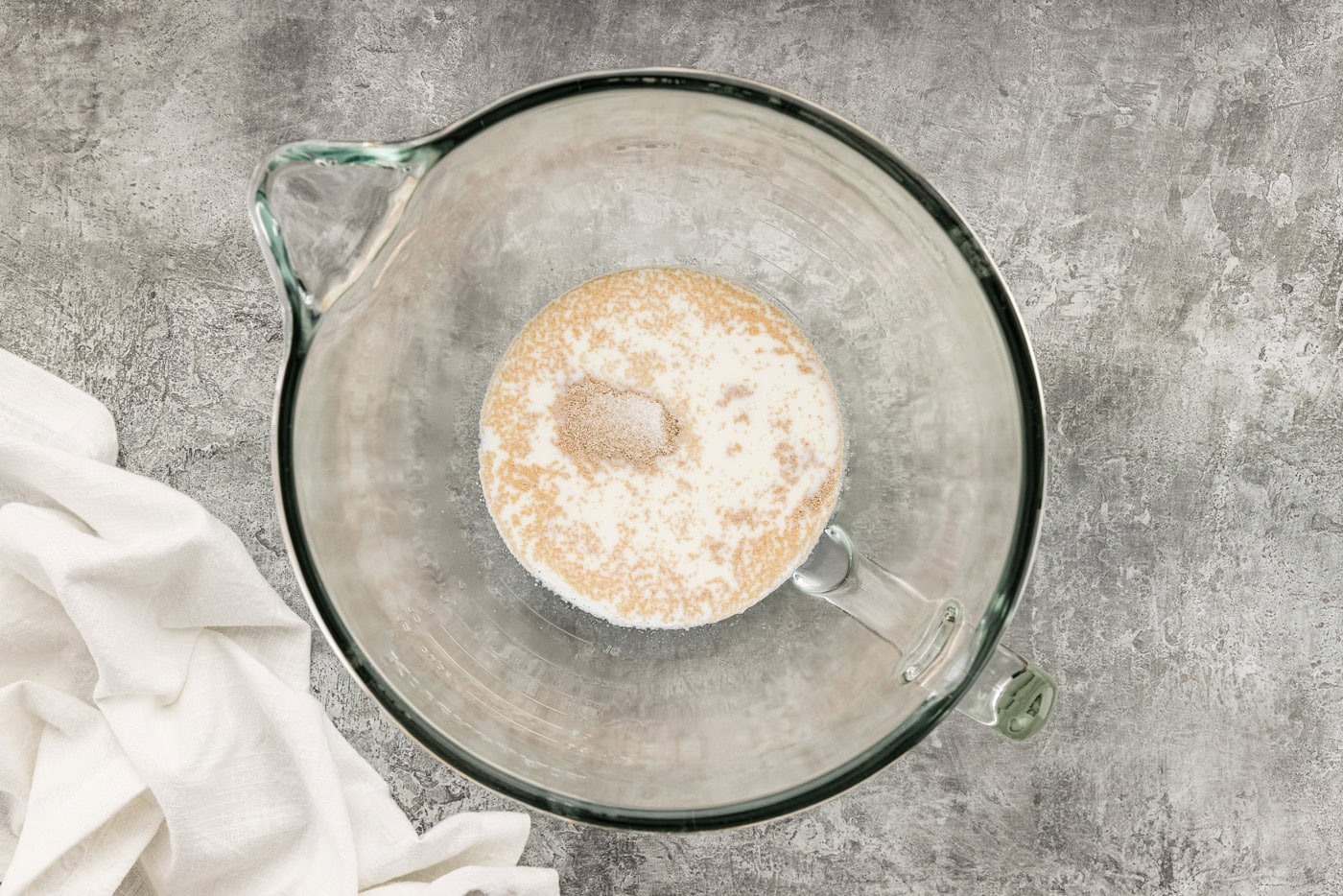 yeast over warm milk in a bowl