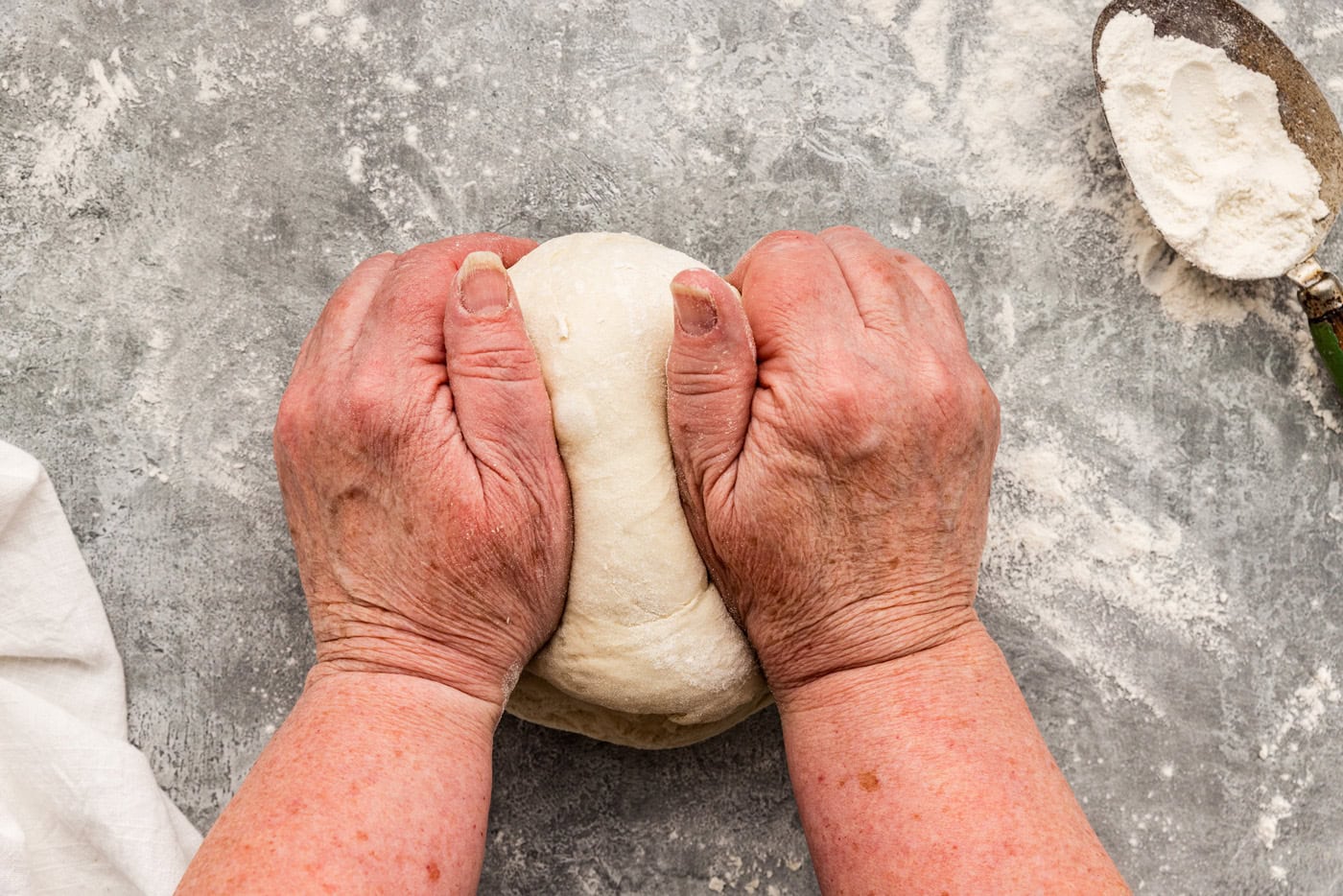 kneading dough with hands