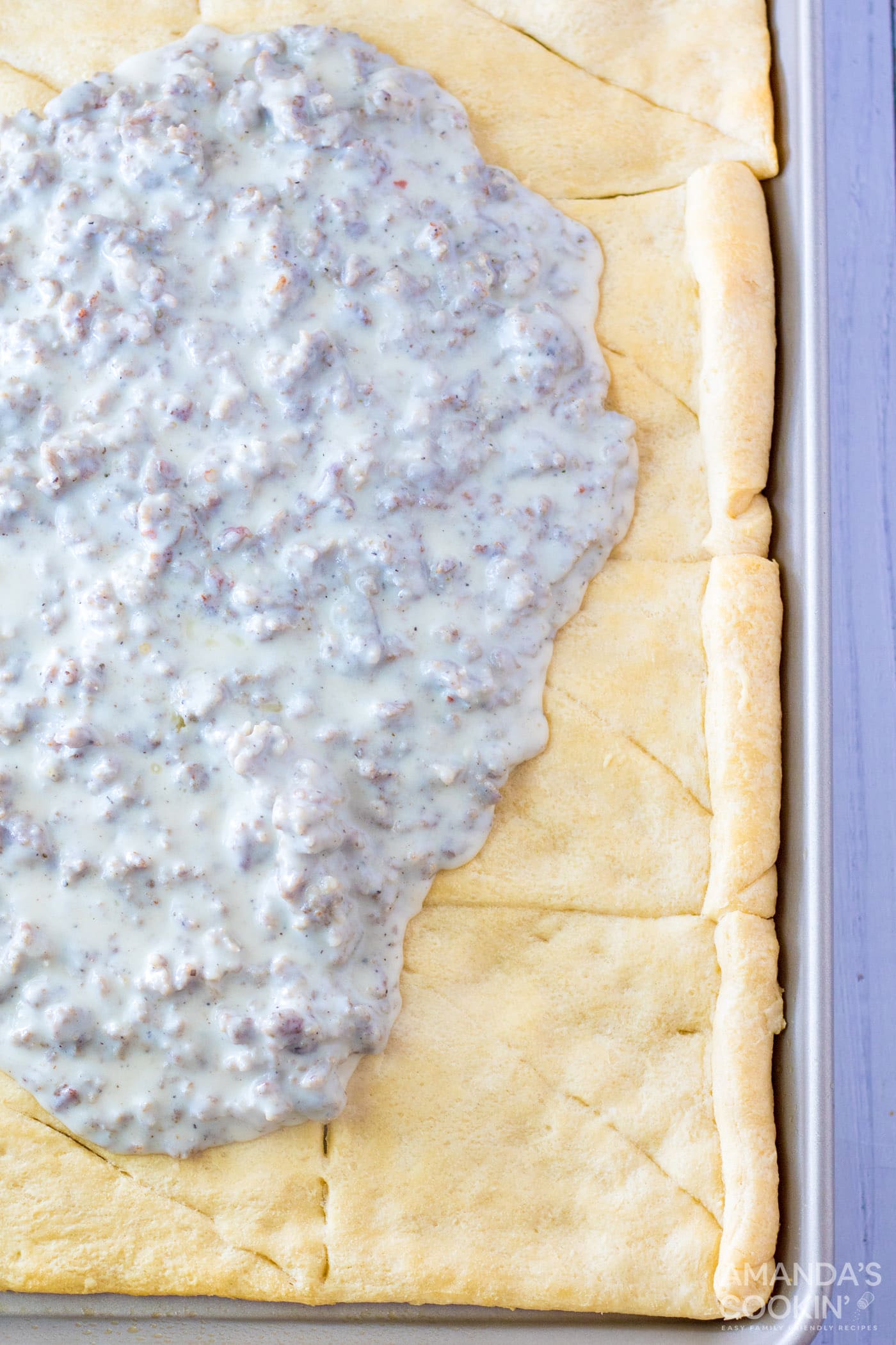 sausage gravy on top of crescent dough