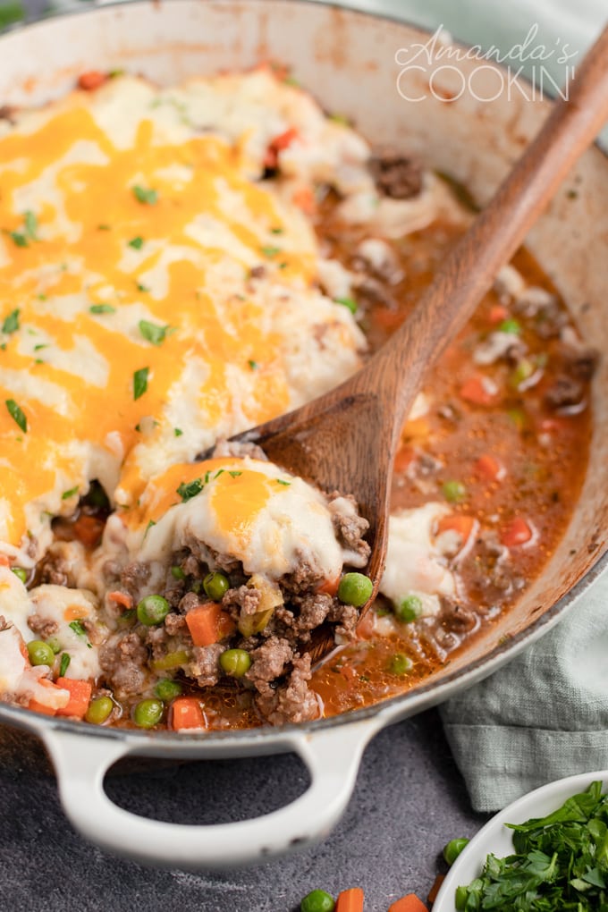 spoon lifting shepherds pie from pan