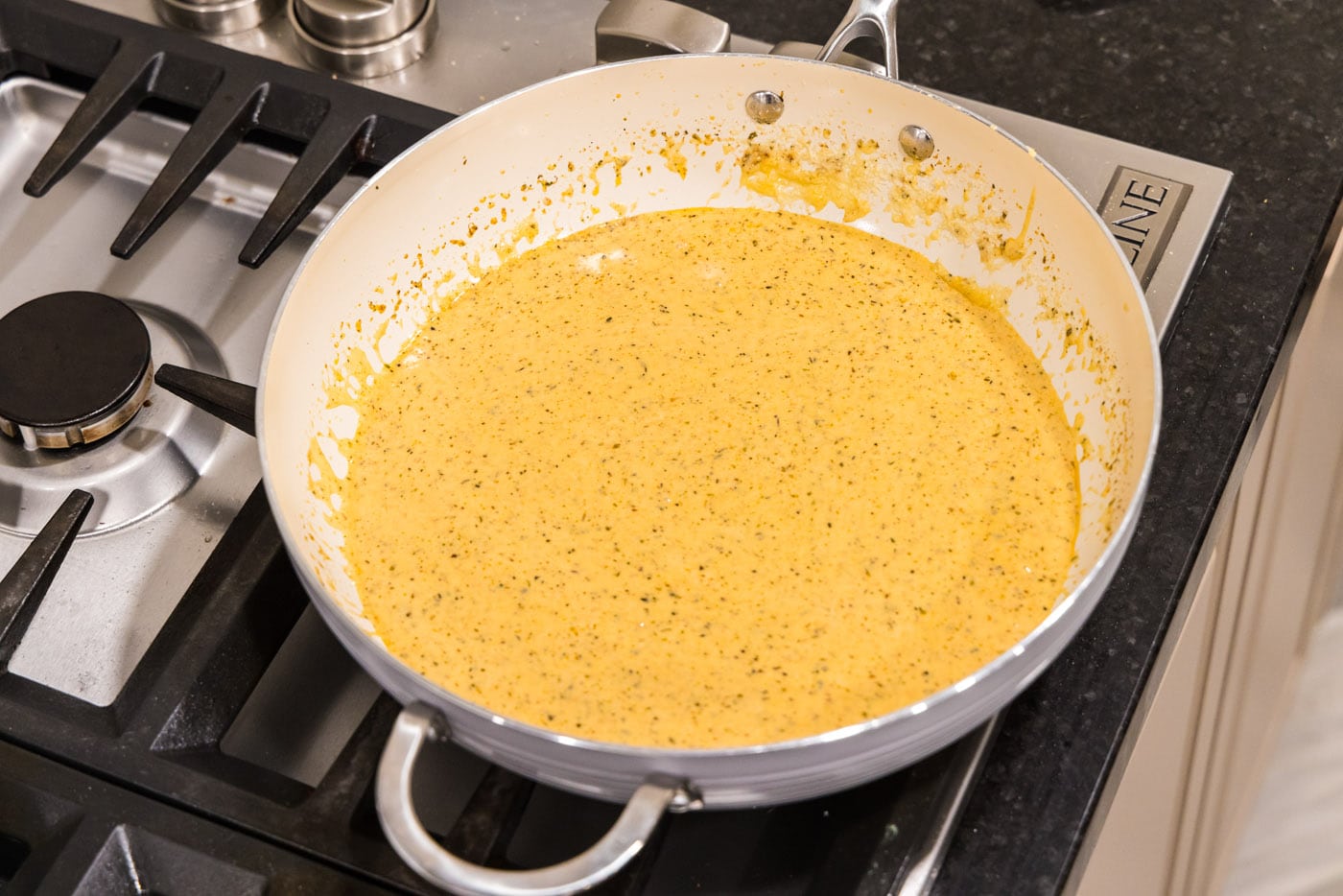 homemade alfredo sauce in skillet