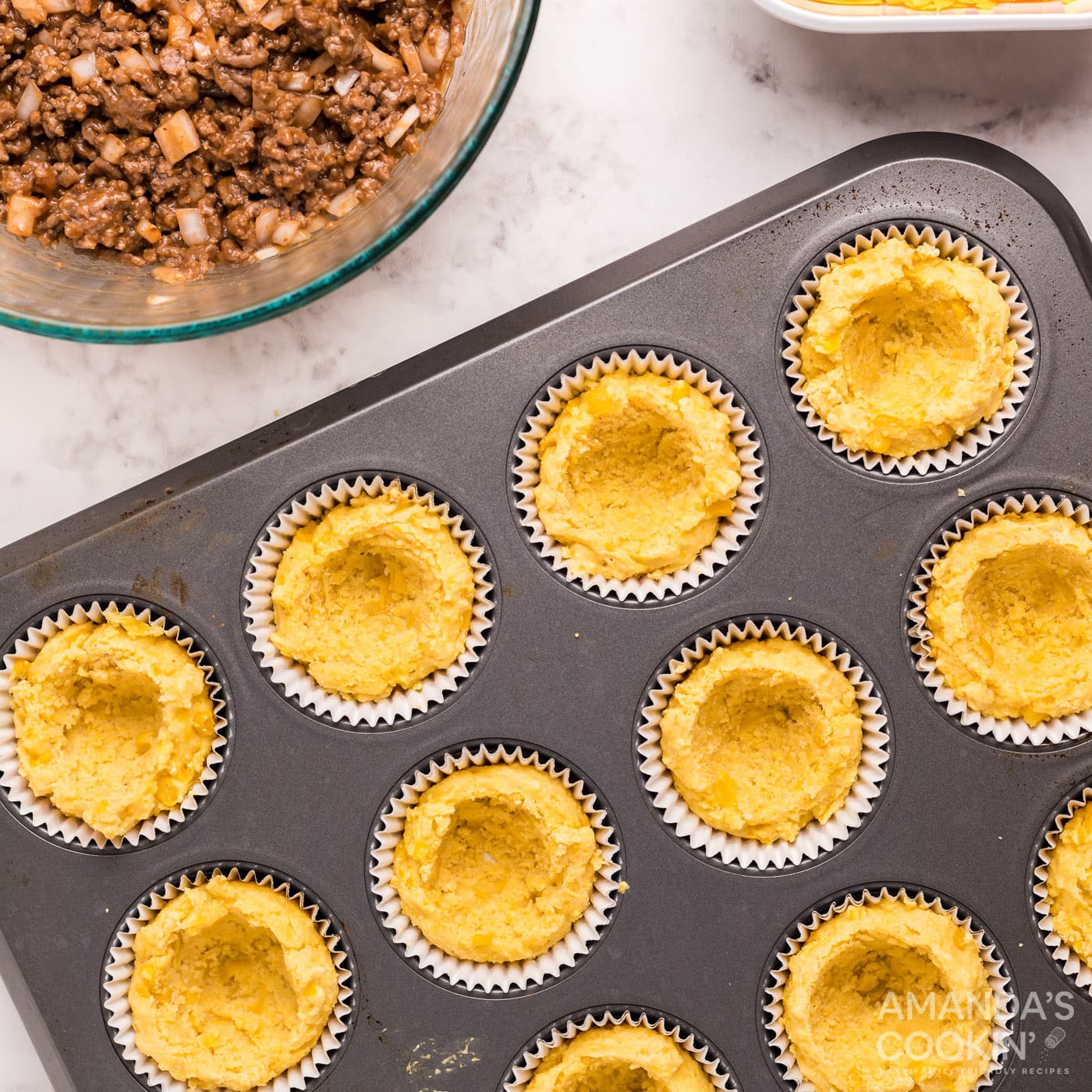 center of cornbread removed in a muffin tin