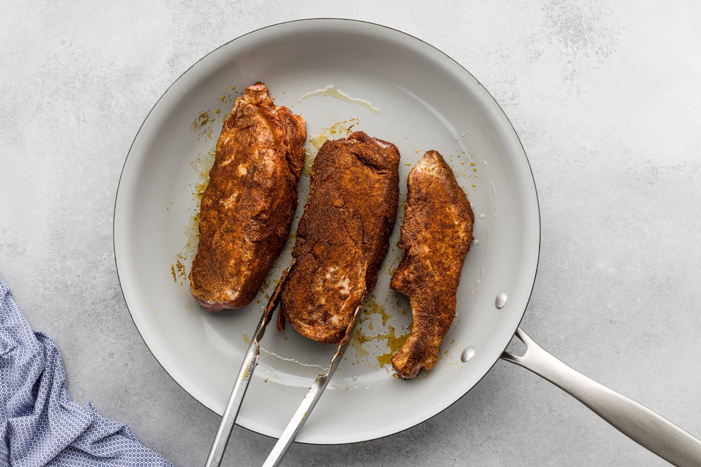 searing country style ribs in a skillet