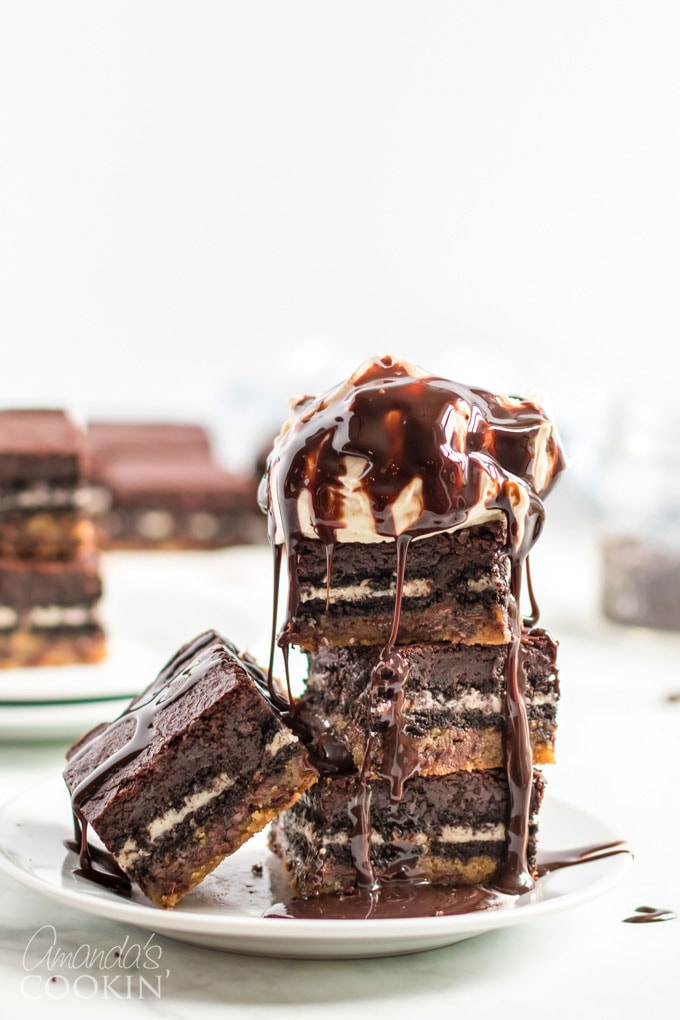 slutty brownies on a plate with ice cream and syrup