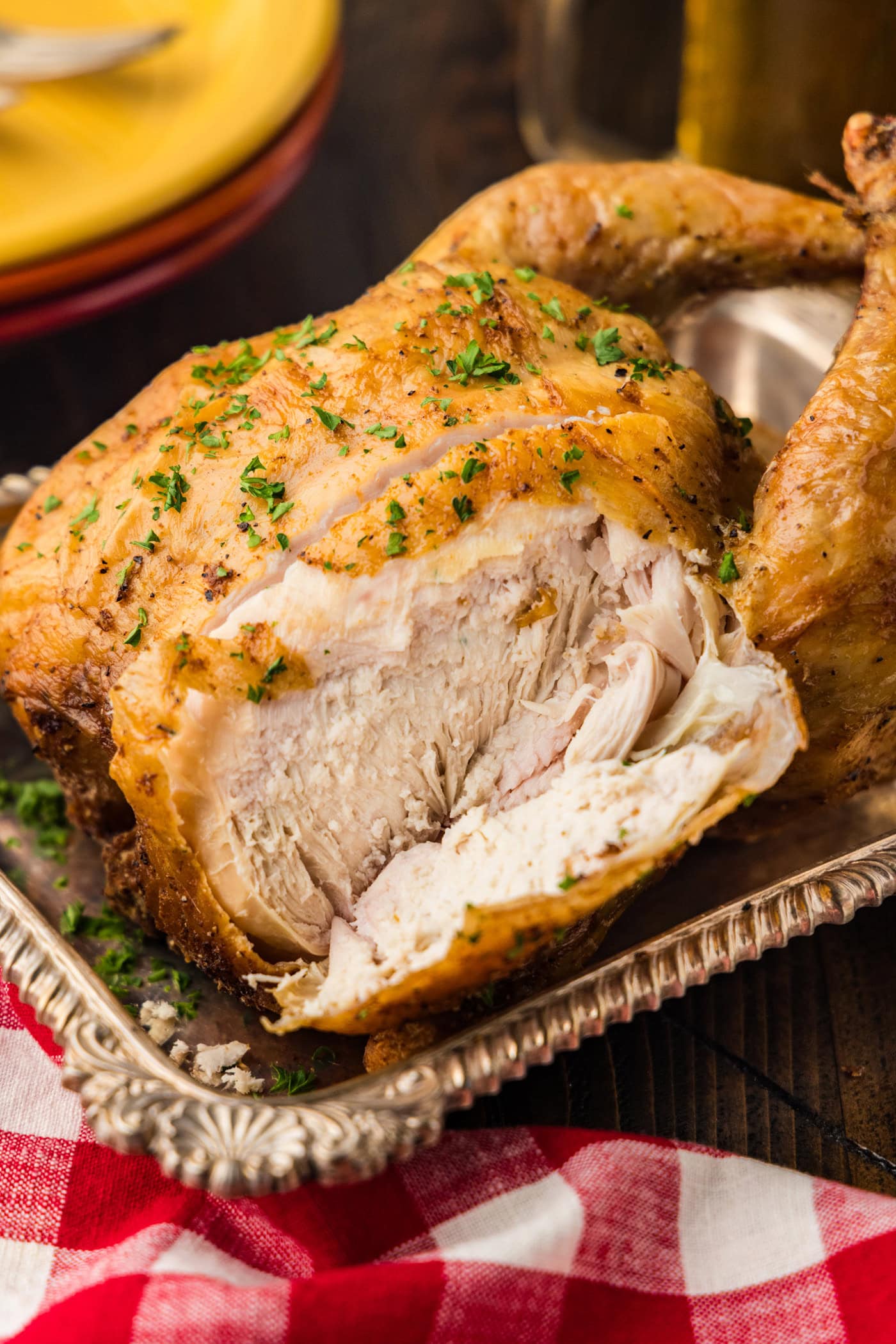 smoked beer can chicken carved in a serving tray