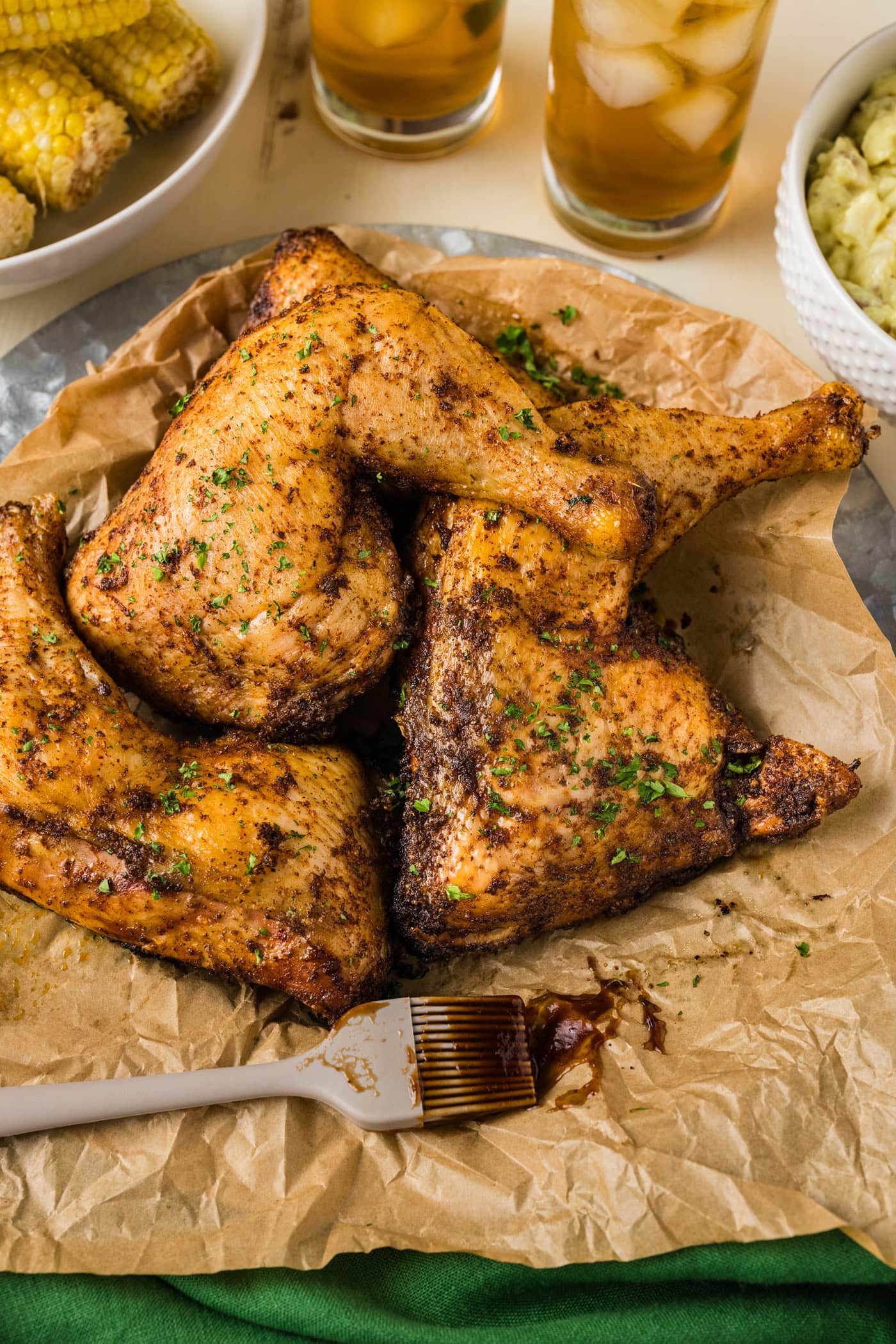 Smoked Chicken Quarters on a parchment lined platter