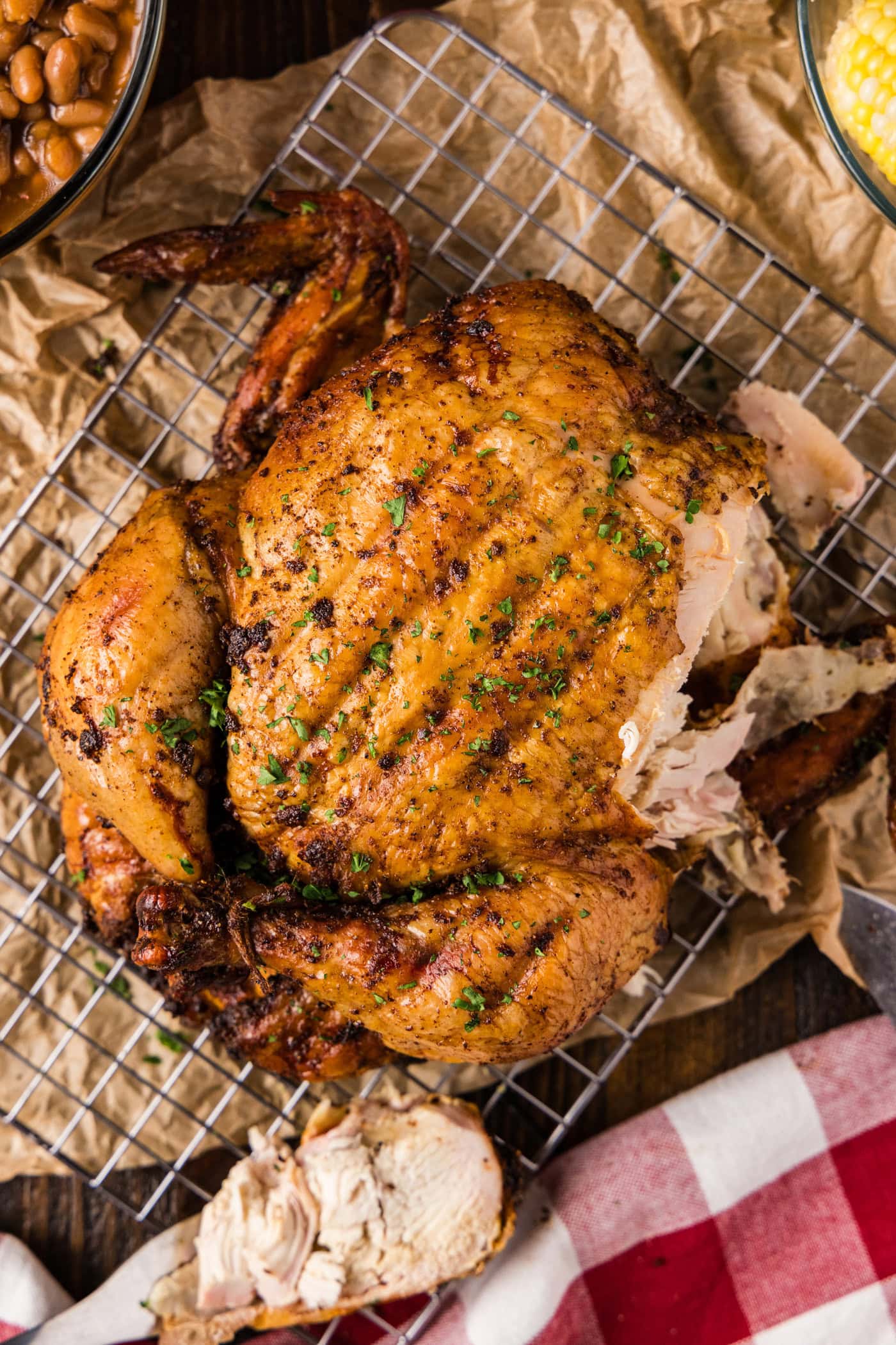Smoked Chicken cut apart on a wire rack