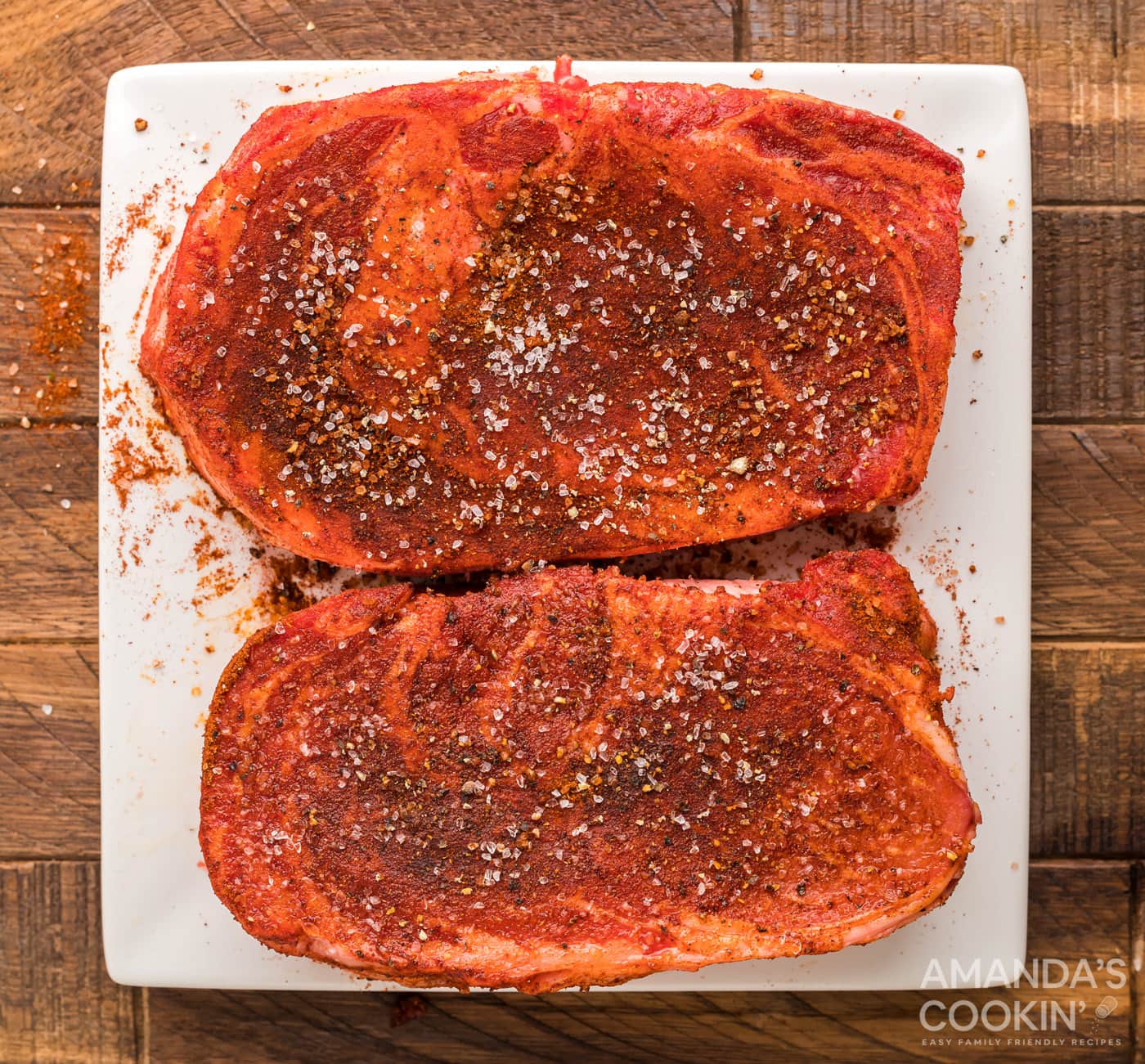 seasoned ribeye on cutting board