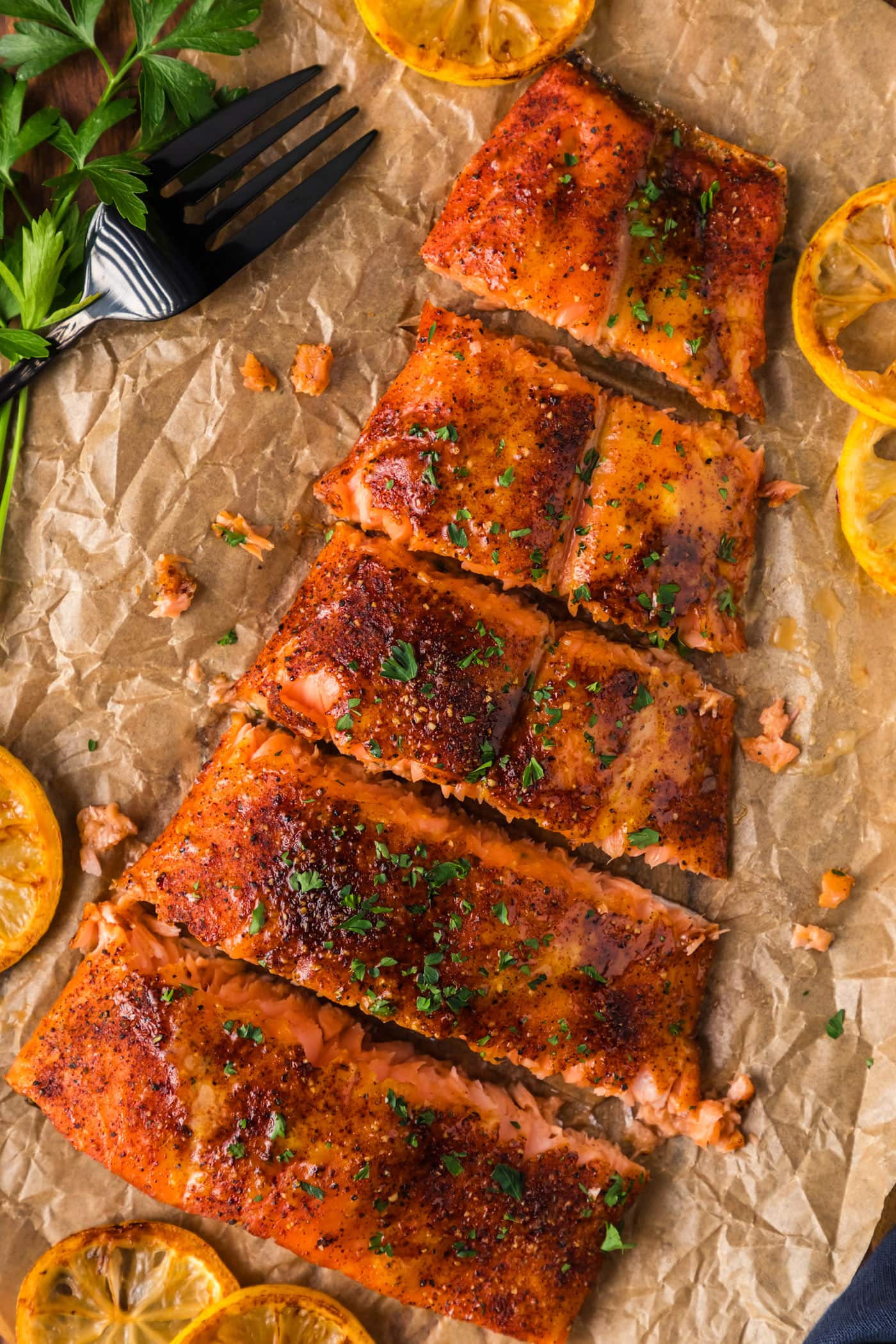 Smoked Salmon cut into filets resting on parchment paper