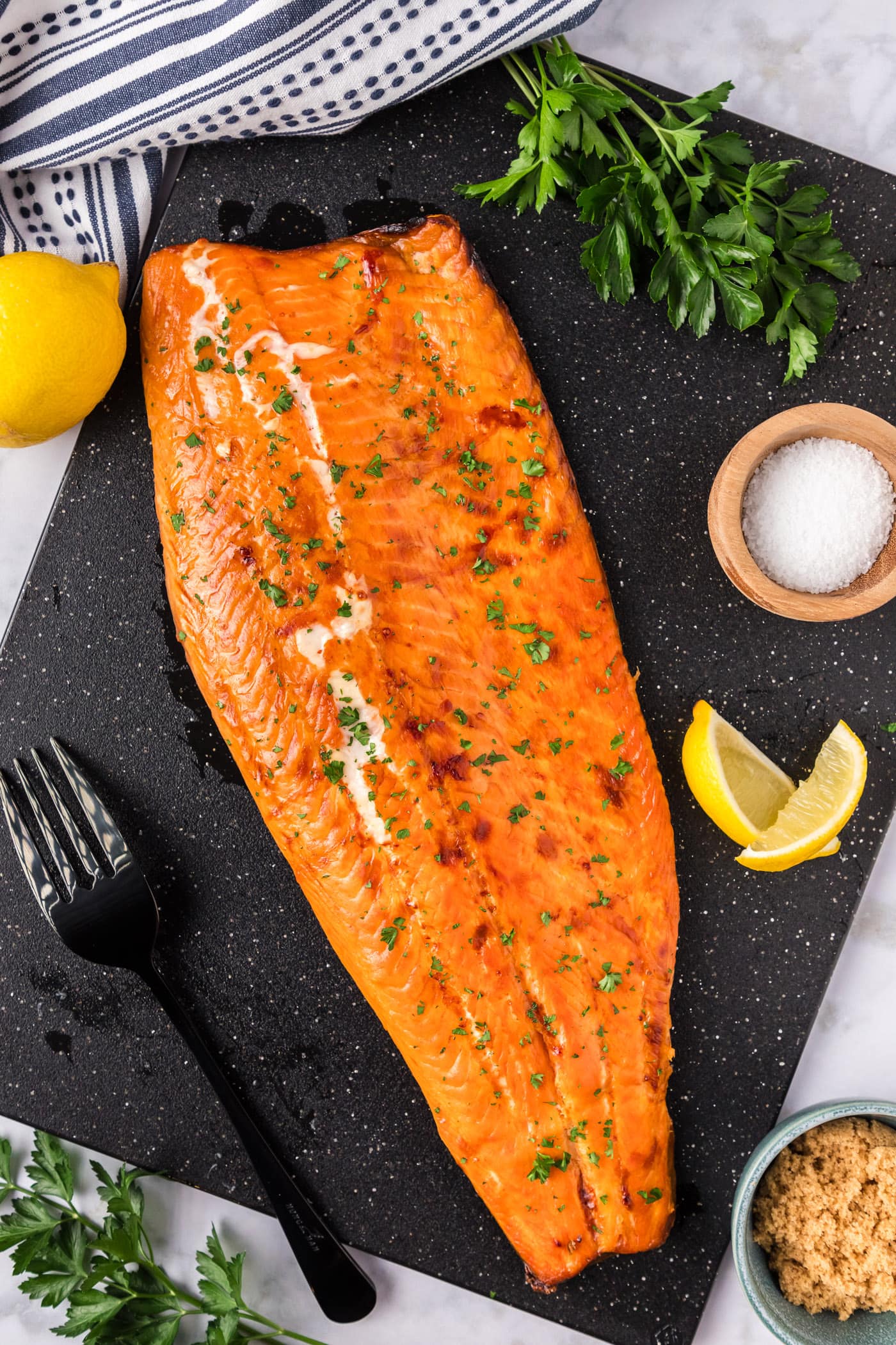 Overhead photo of Smoked Trout on a black board