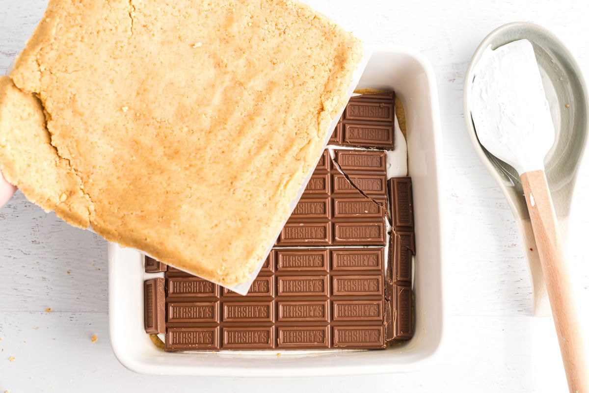 placing dough on top of chocolate layer