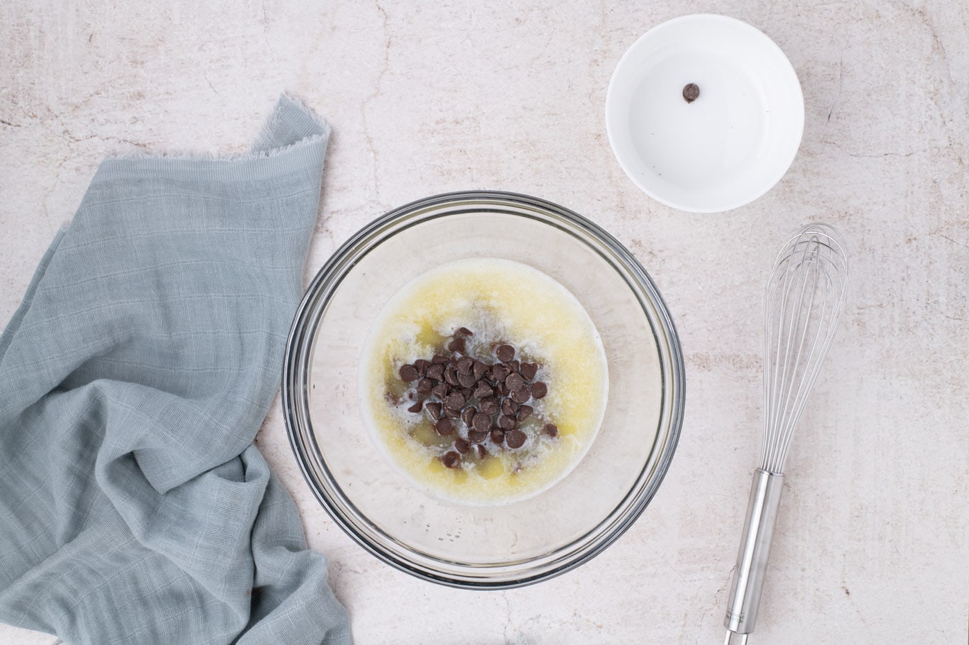 chocolate chips in a bowl with melted butter
