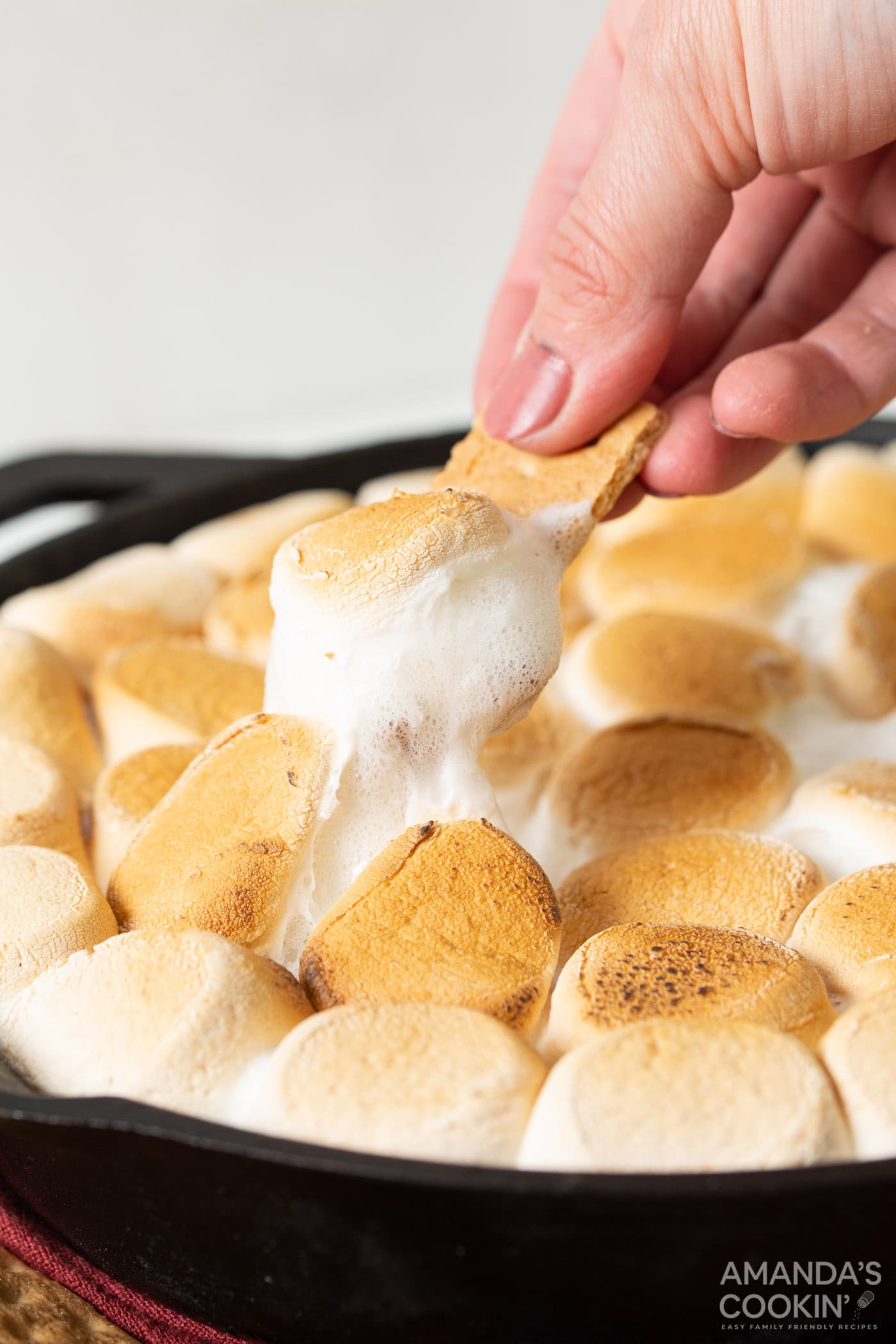 Scoop of S'mores Dip on a graham cracker