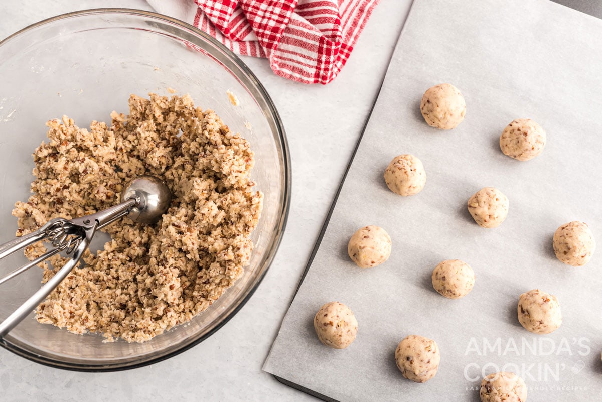 cookie balls on baking sheet