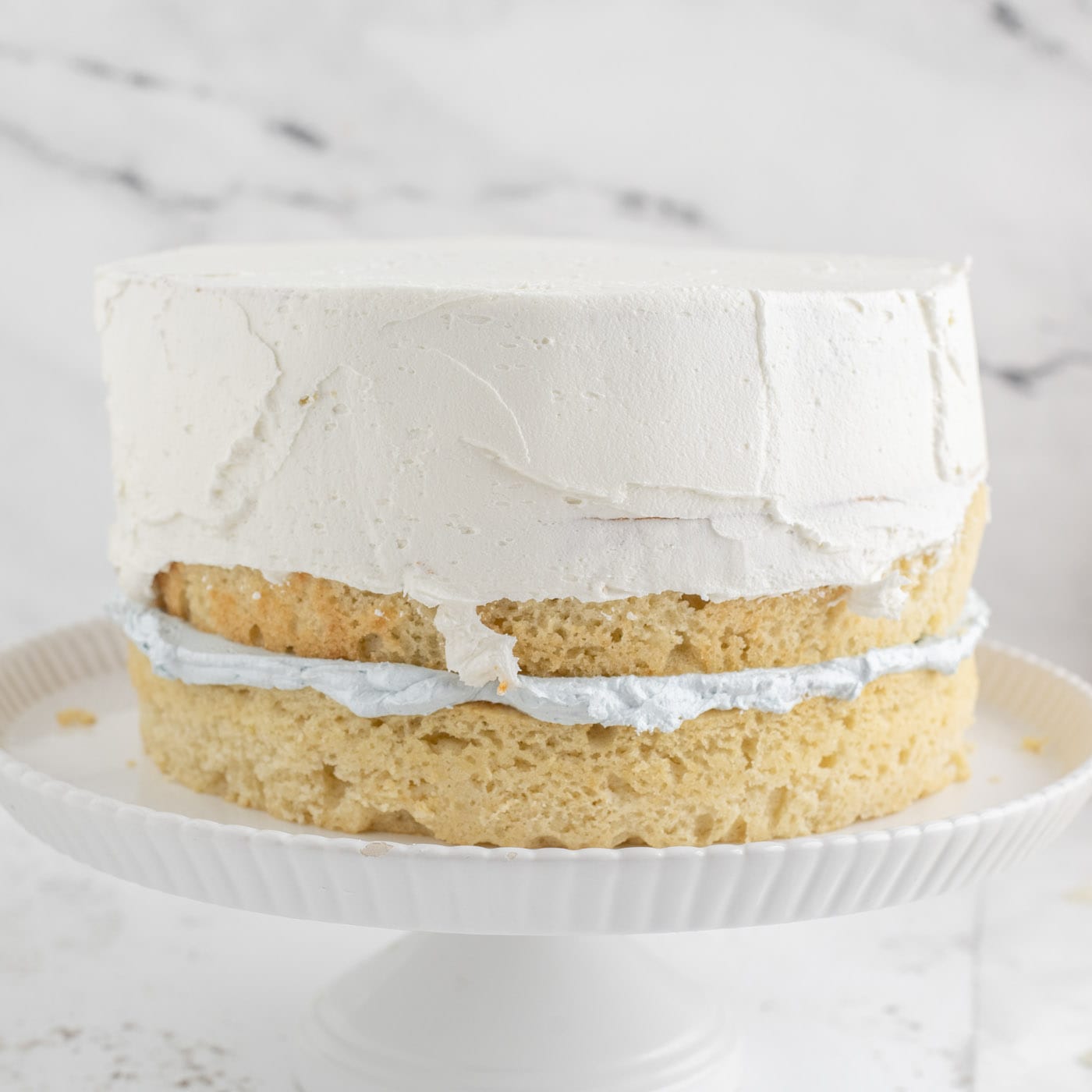 frosting a tiered cake