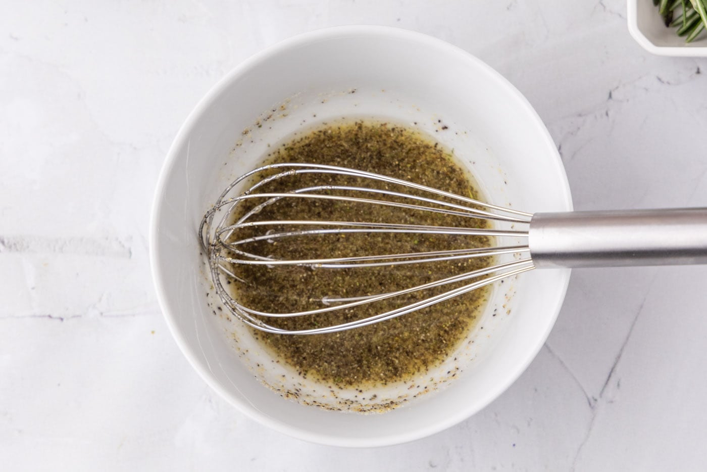 whisked olive oil, garlic salt, and pepper