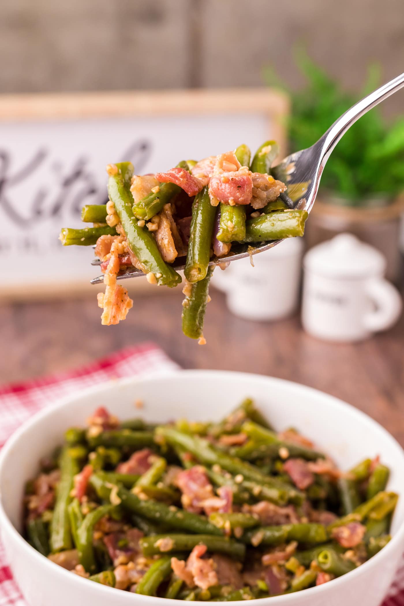 Fork full of Southern Green Beans being lifted out of a bowl of Southern Green Beans