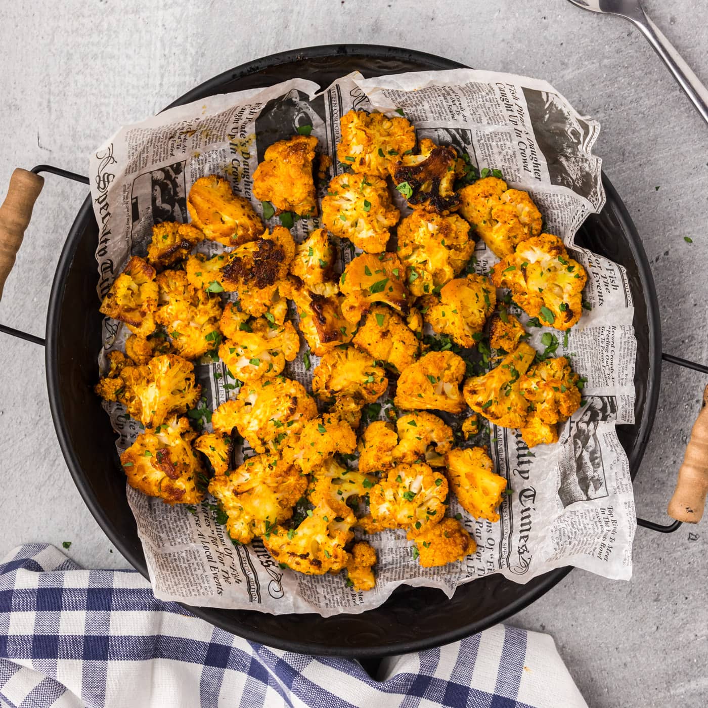 Spicy Roasted Cauliflower in a round serving dish