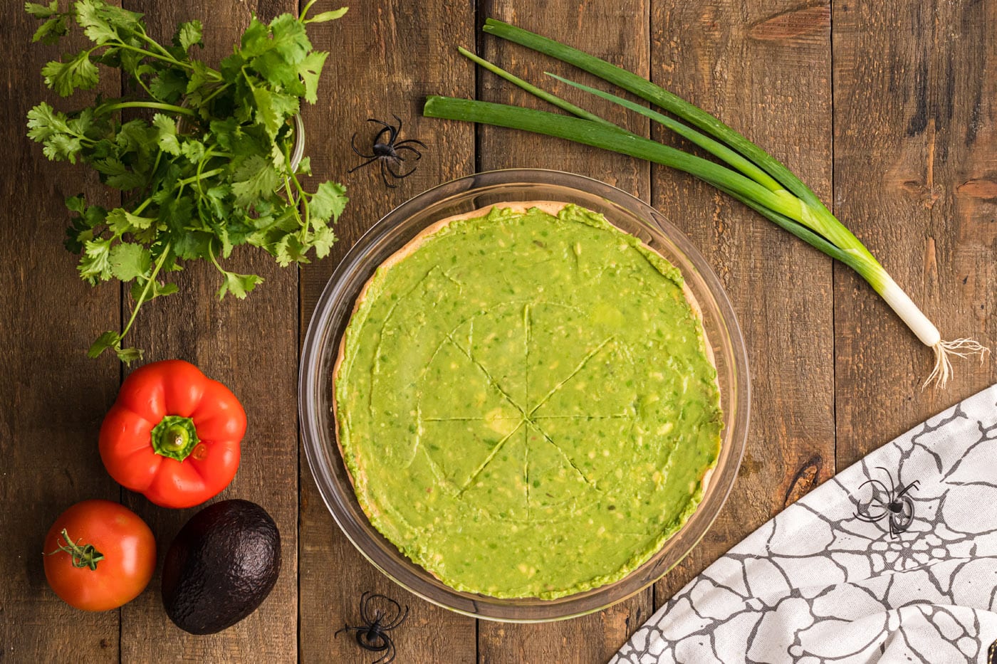 guacamole layer over taco dip
