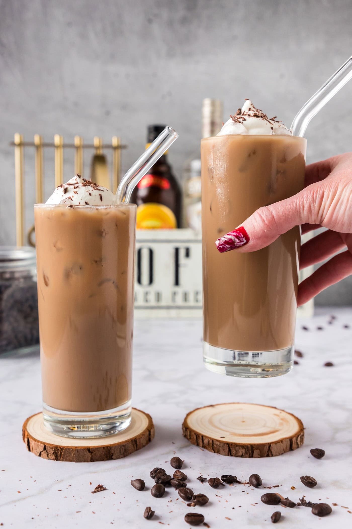 Hand holding up a Spiked Iced Coffee