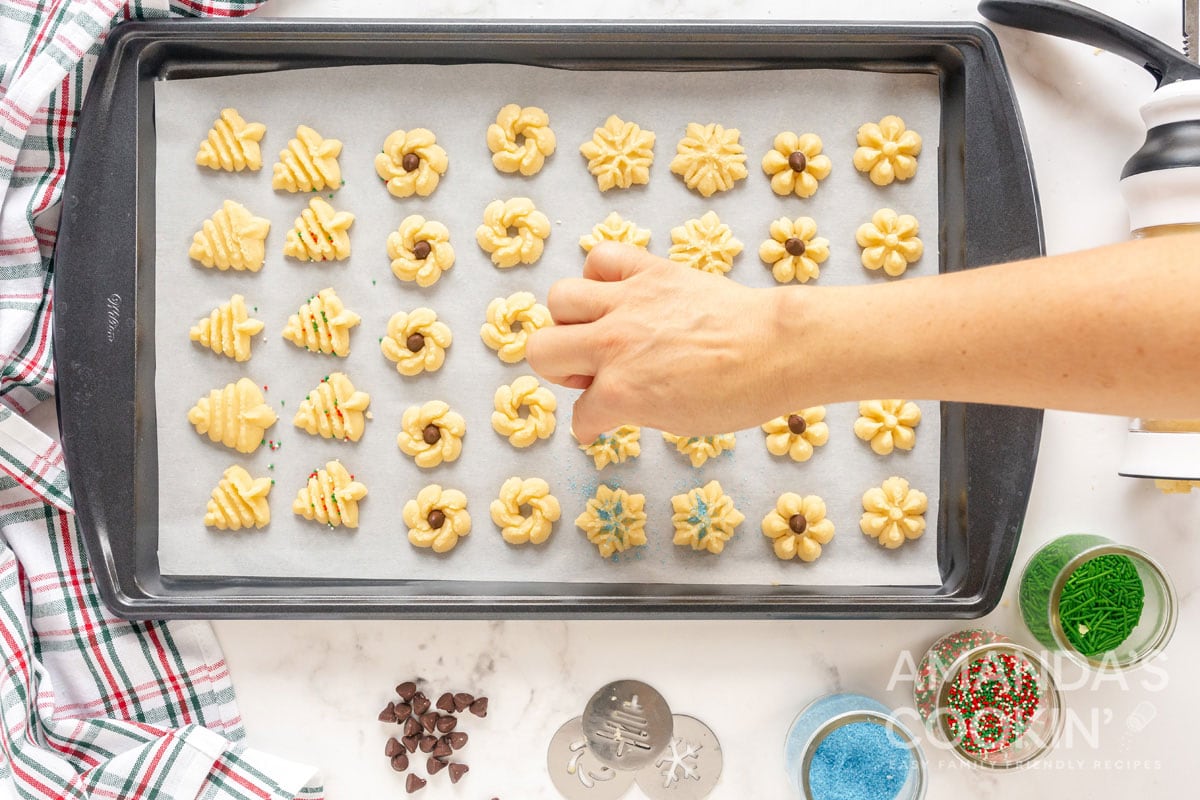 adding colored sugar to cookies