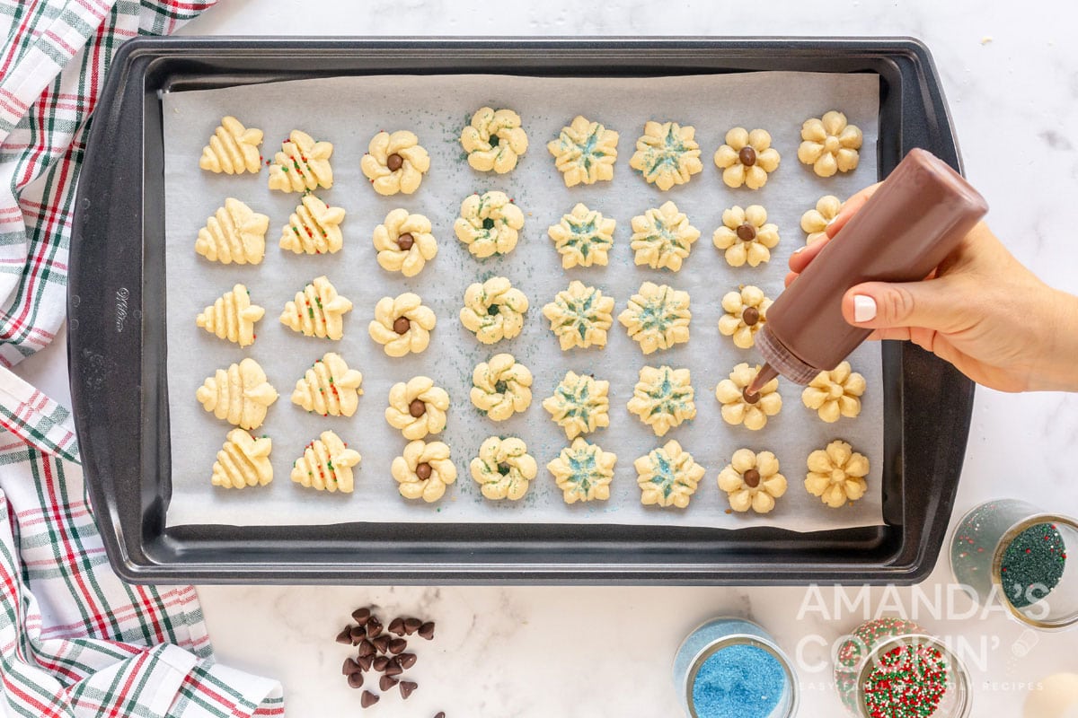 adding chocolate drizzle