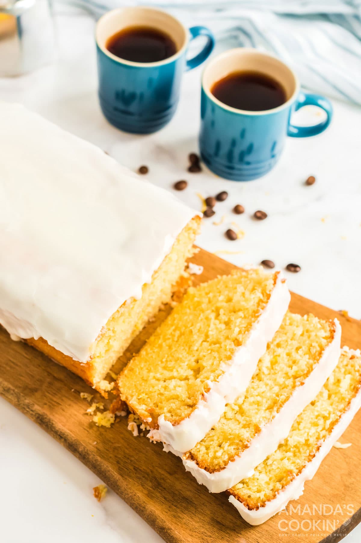 sliced lemon loaf on a cutting board