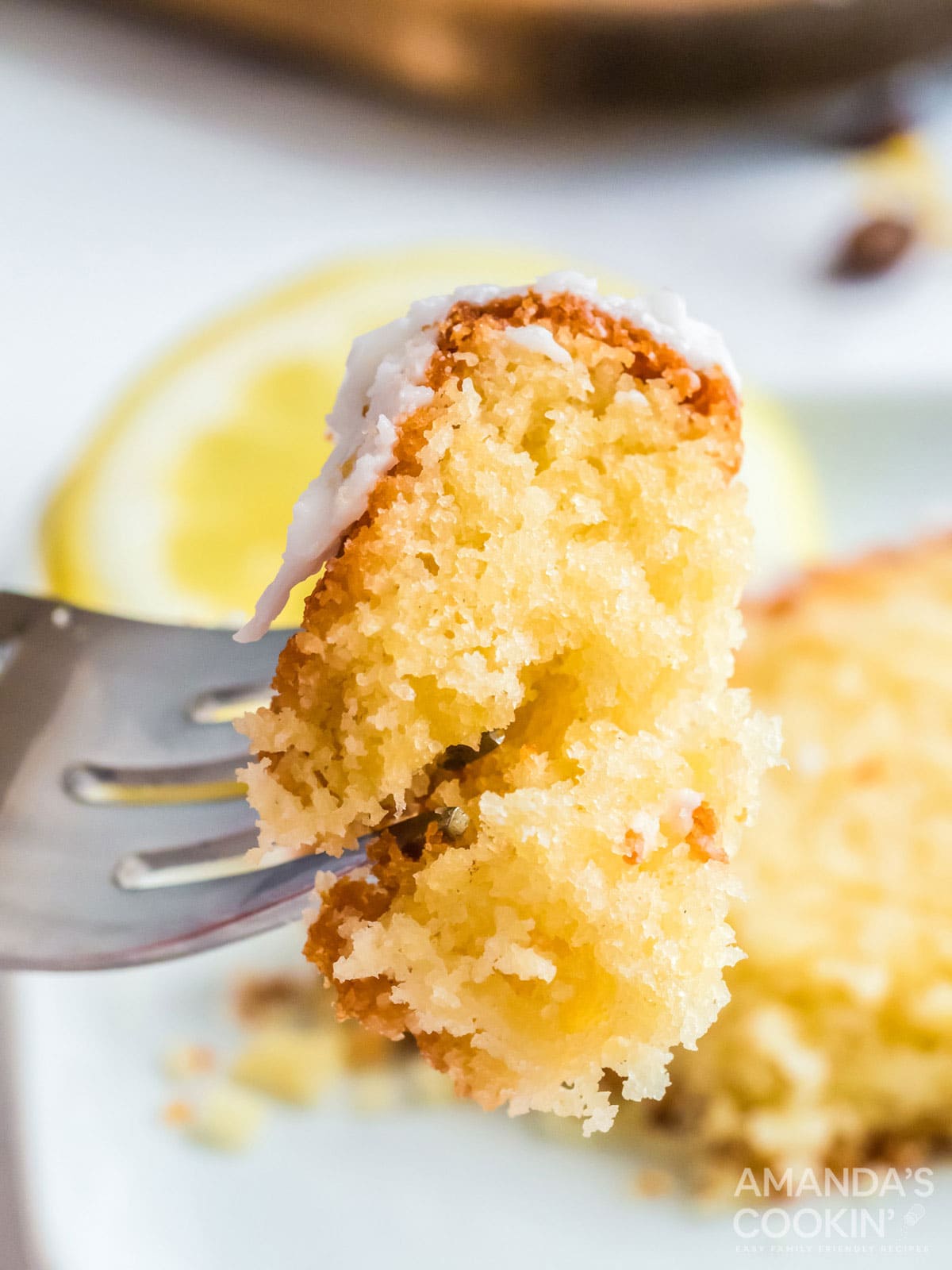 fork holding a piece of copycat starbucks lemon loaf