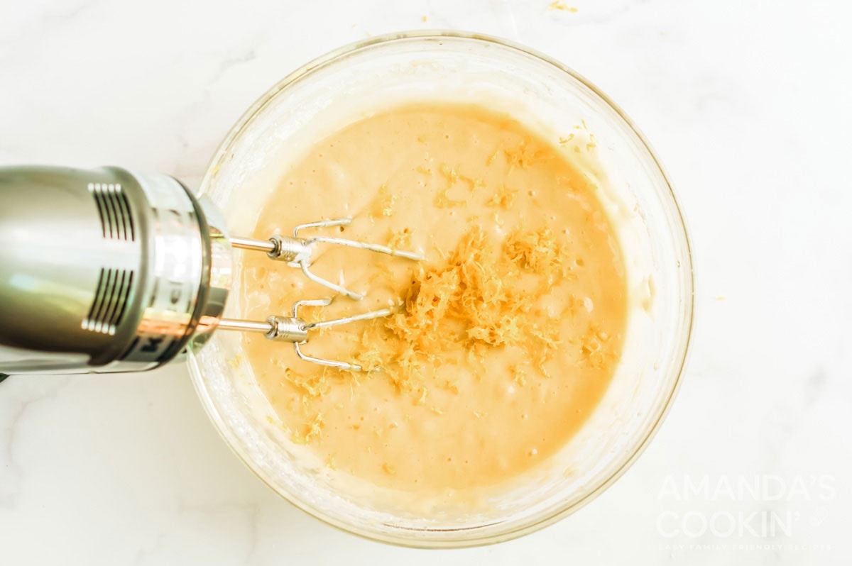 lemon zest added to bowl of batter