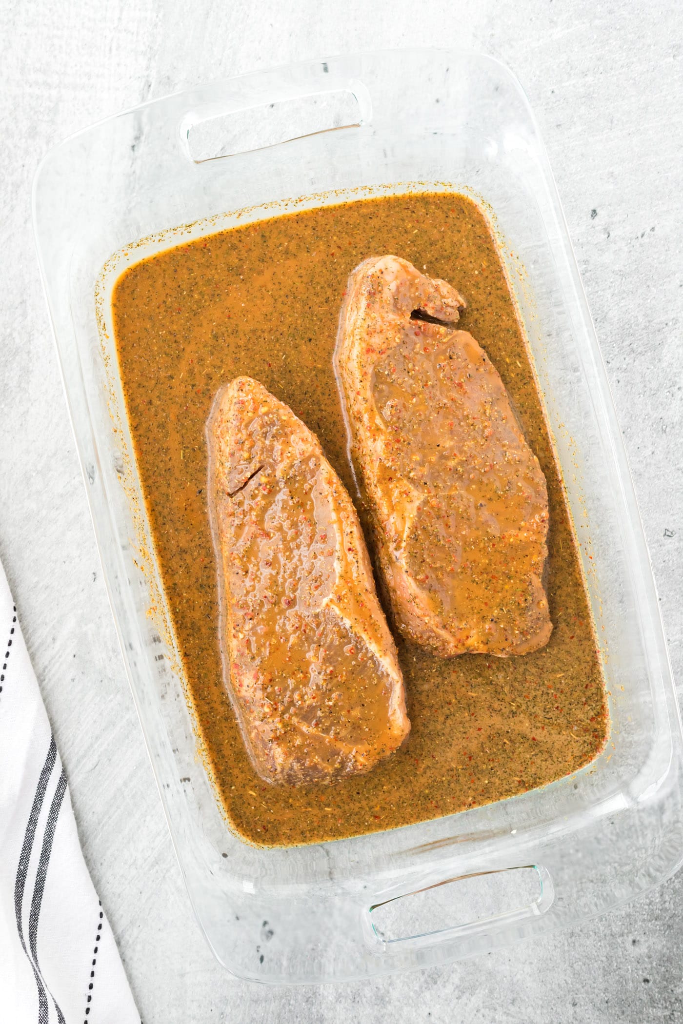 Steak Marinating in a pan