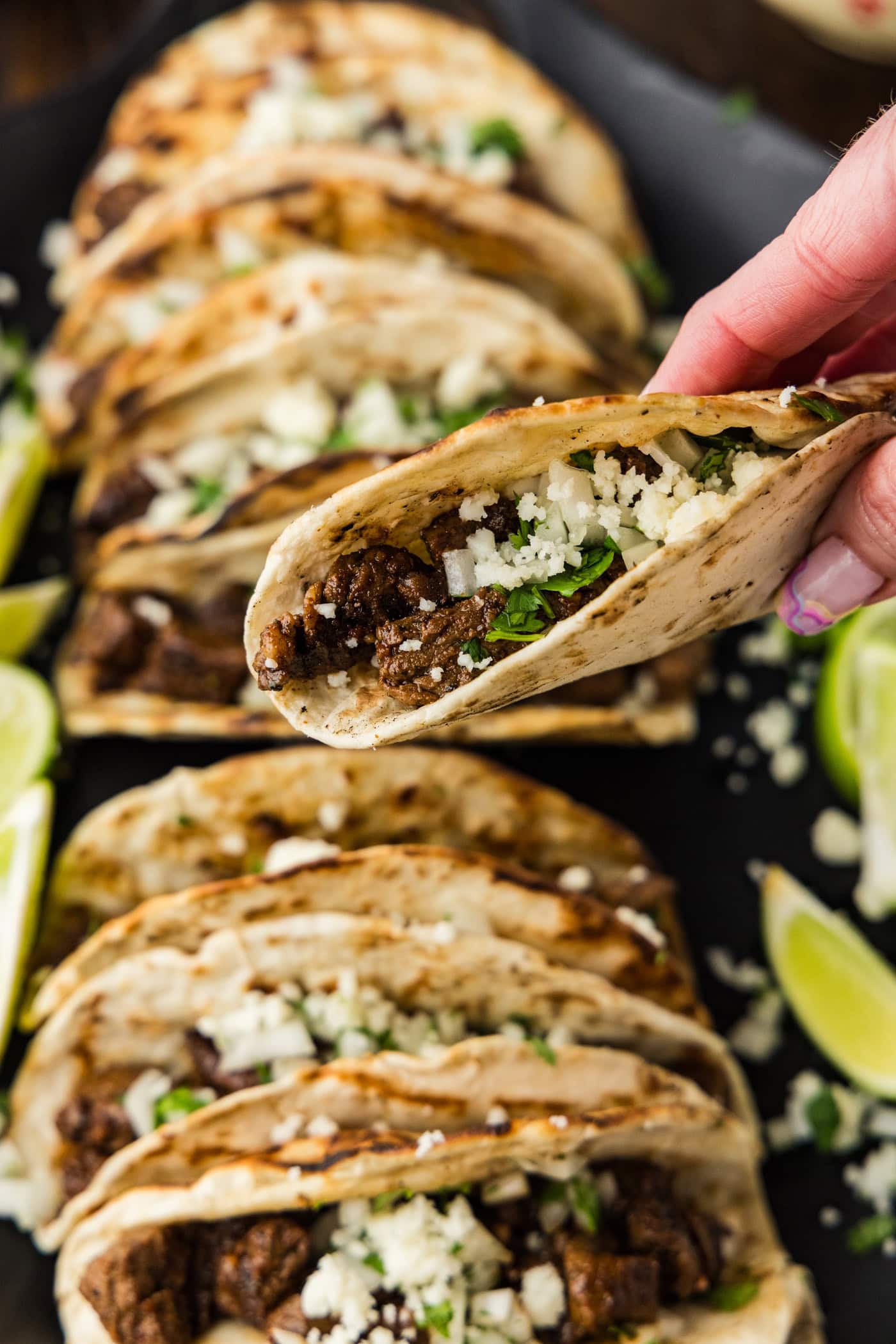 holding a Steak Soft Taco