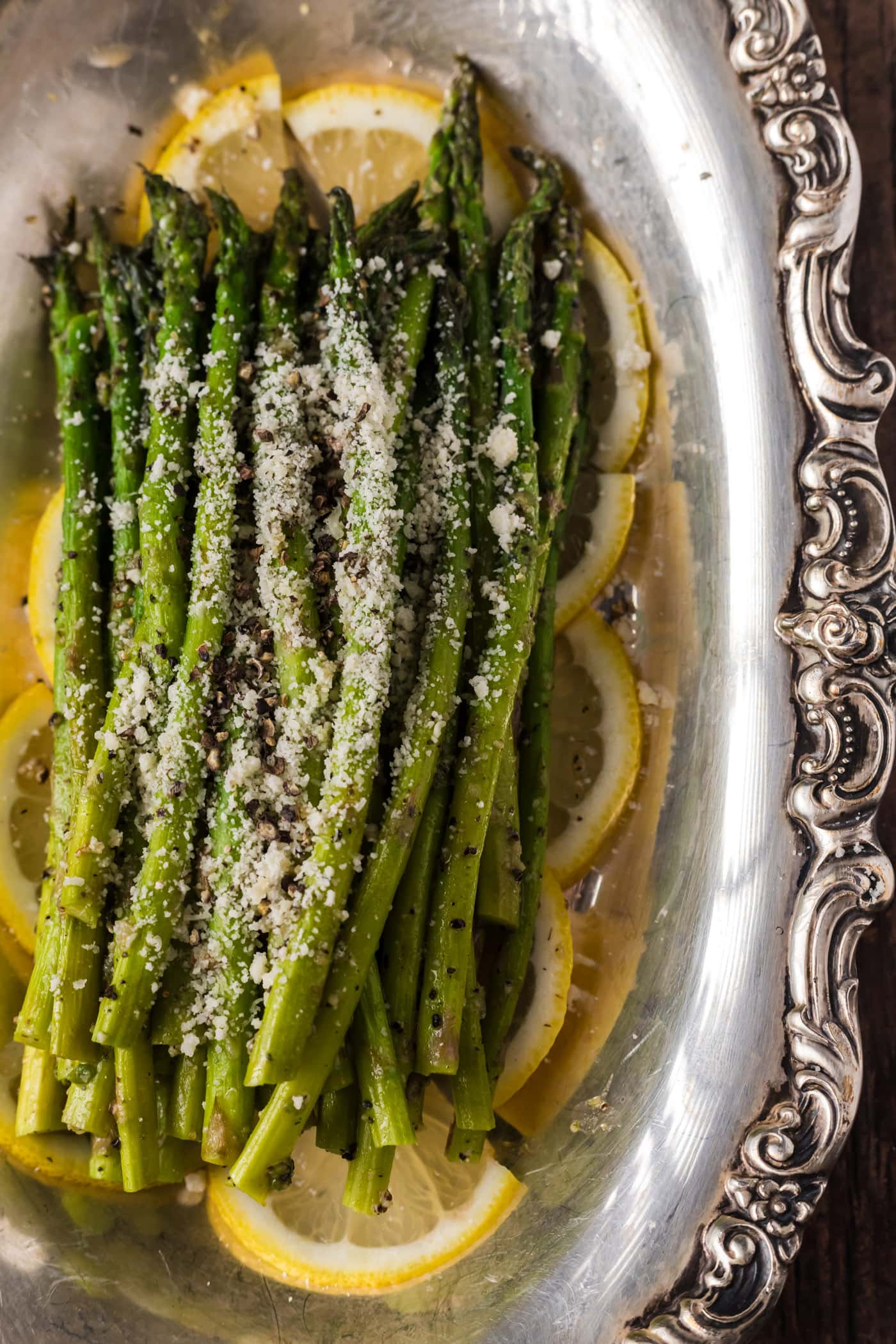 Close up photo of Steamed Asparagus topped with parmesan